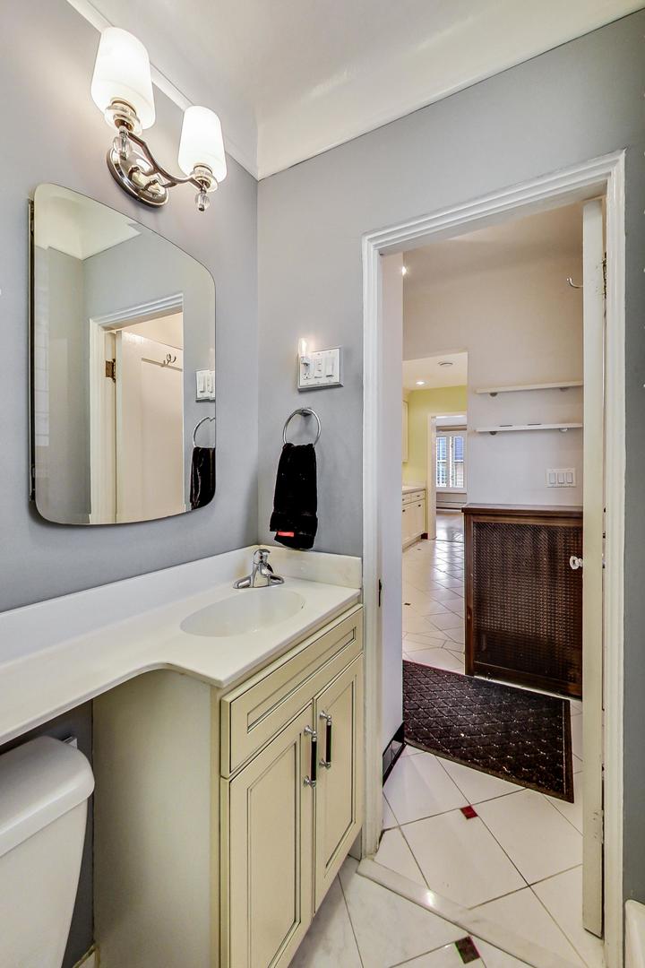 280 Nuttall Road Riverside, IL 60546 - Photo 15 of 52 a bathroom with a sink a toilet and mirror