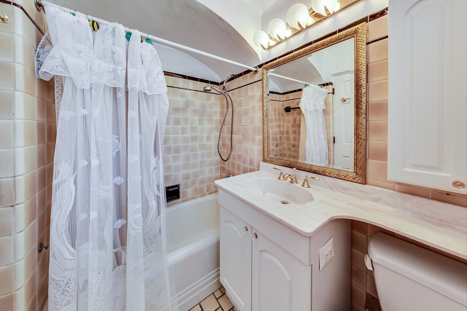 280 Nuttall Road Riverside, IL 60546 - Photo 19 of 52 a bathroom with a sink vanity granite tub shower and a mirror