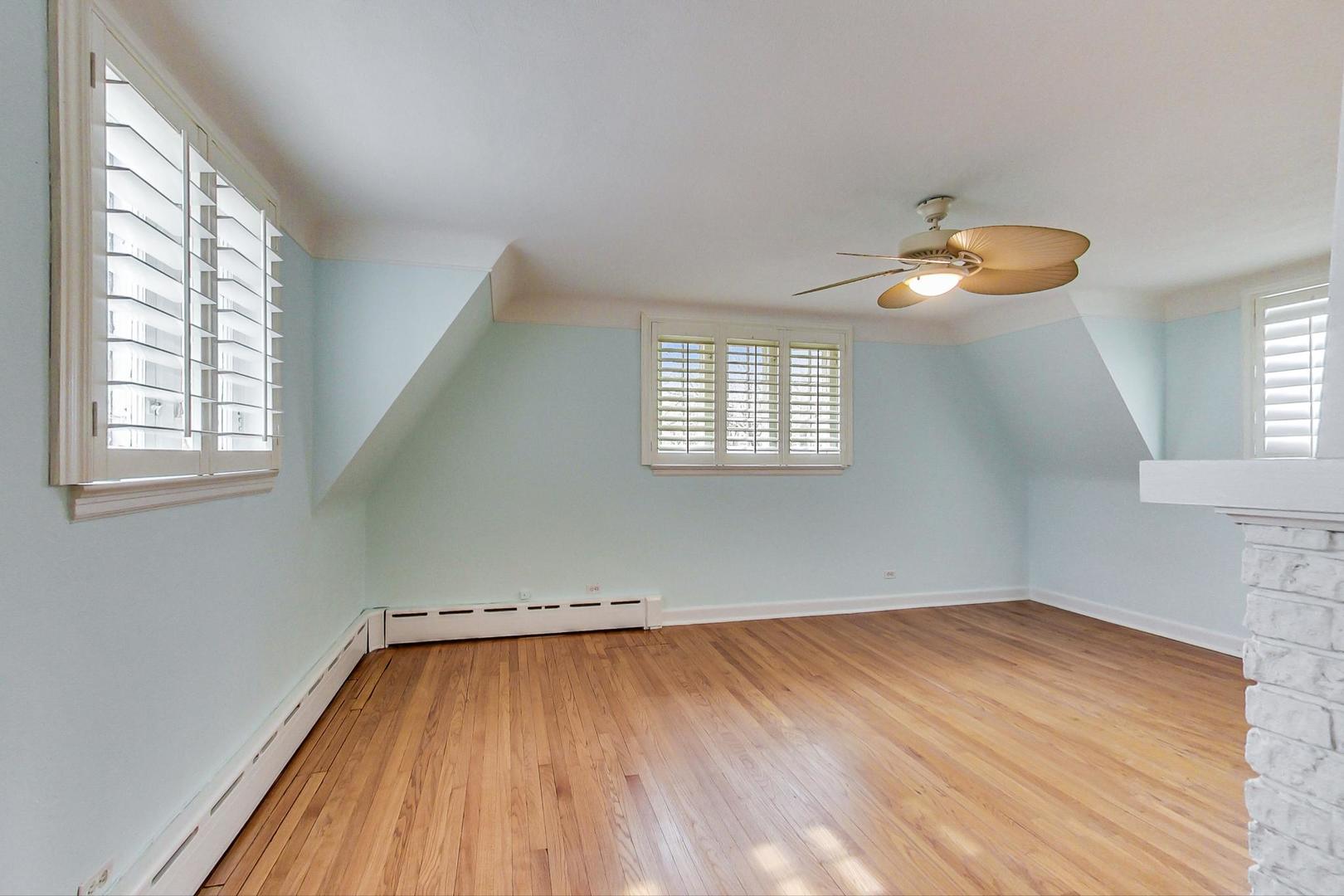 280 Nuttall Road Riverside, IL 60546 - Photo 21 of 52 an empty room with wooden floor and windows