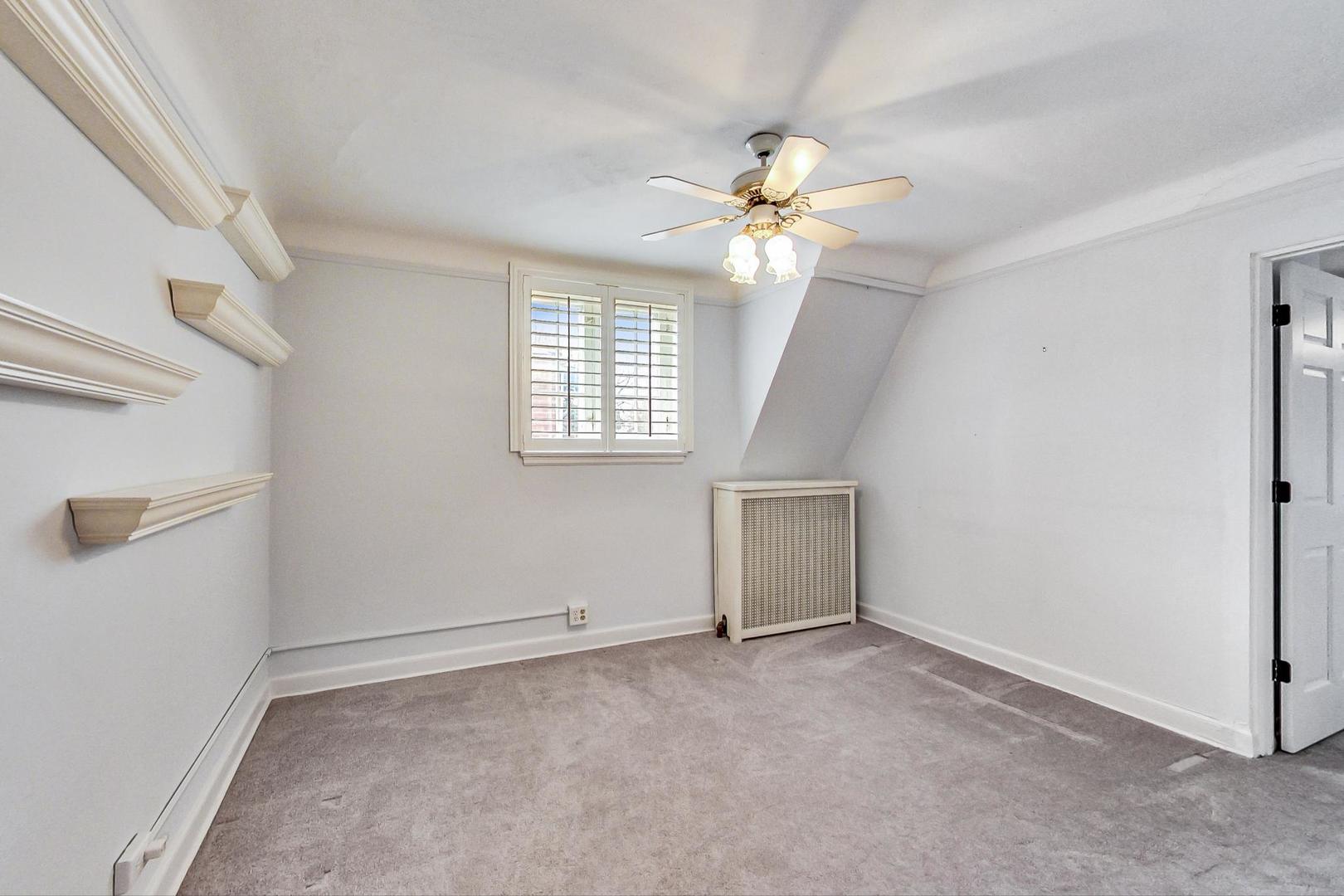 280 Nuttall Road Riverside, IL 60546 - Photo 24 of 52 an empty room with windows and fan