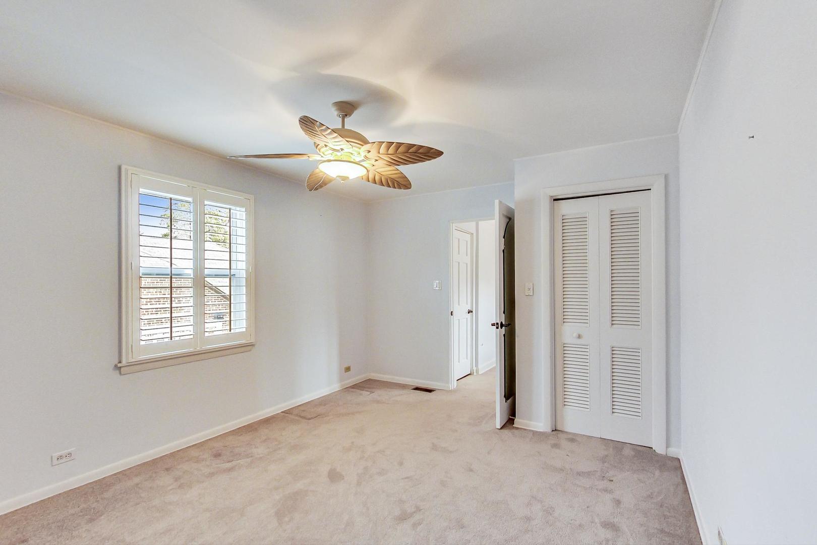 280 Nuttall Road Riverside, IL 60546 - Photo 28 of 52 an empty room with a window and a fan