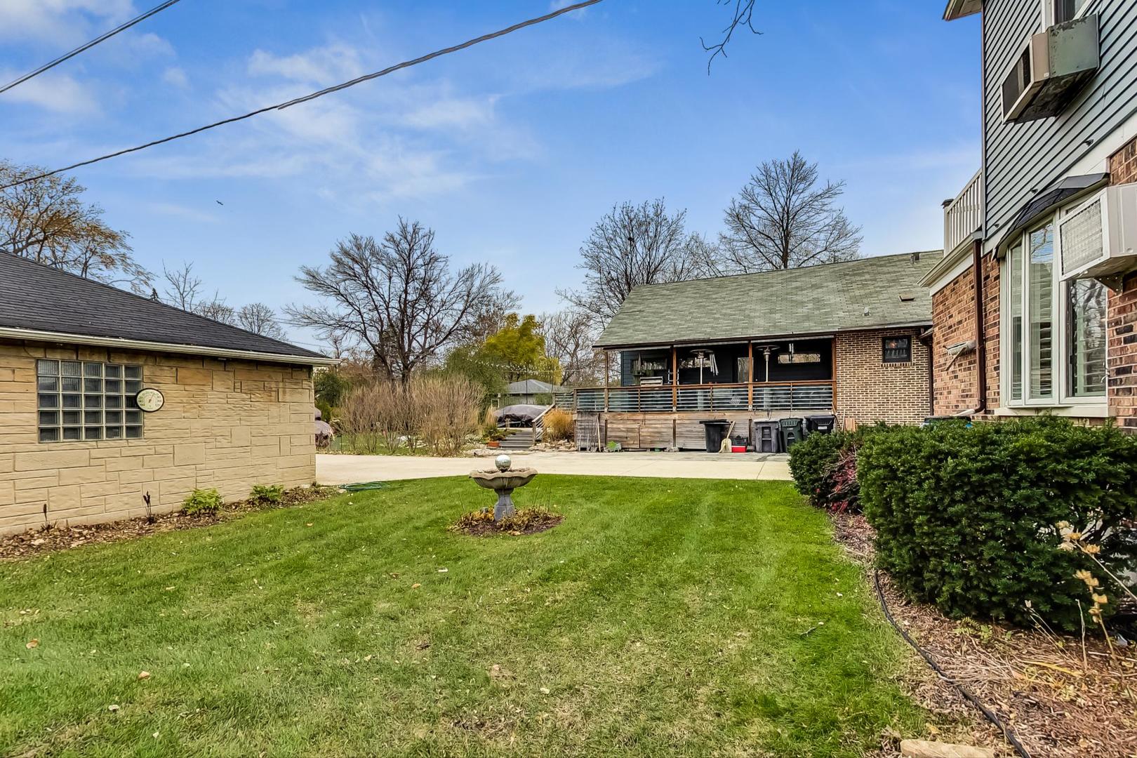 280 Nuttall Road Riverside, IL 60546 - Photo 45 of 52 a front view of a house with swimming pool having outdoor seating