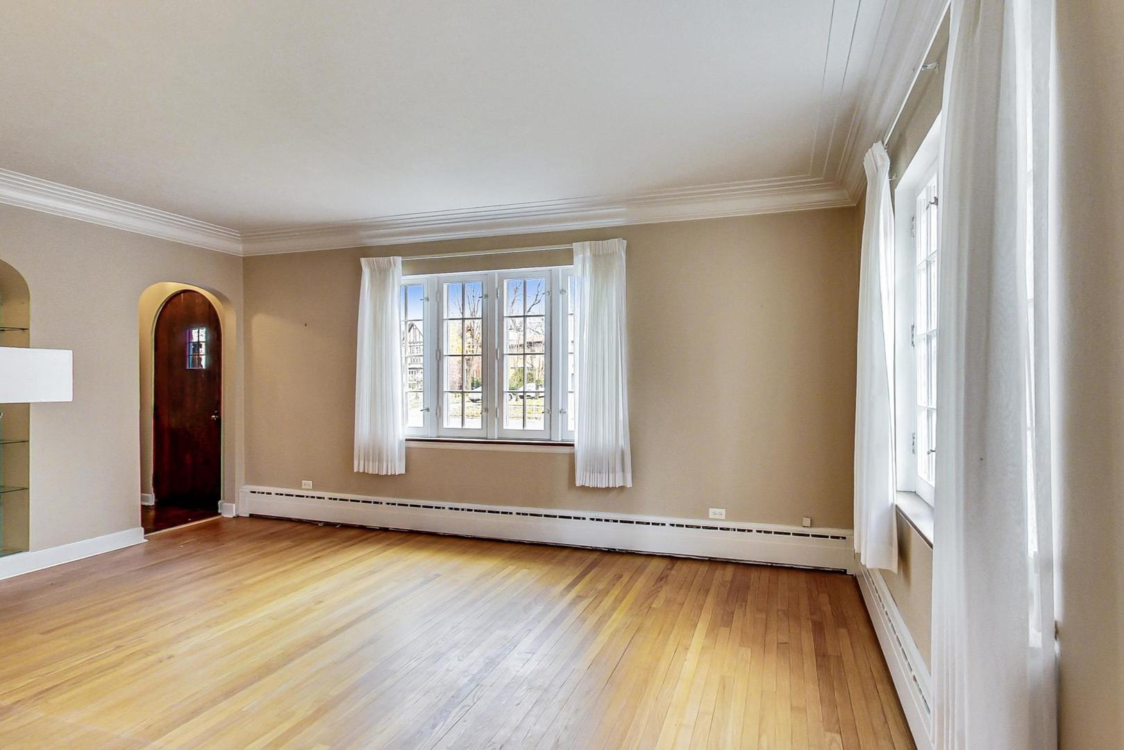 280 Nuttall Road Riverside, IL 60546 - Photo 6 of 52 an empty room with wooden floor and windows