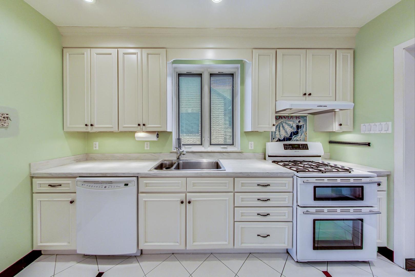 280 Nuttall Road Riverside, IL 60546 - Photo 8 of 52 a kitchen with cabinets appliances and a sink