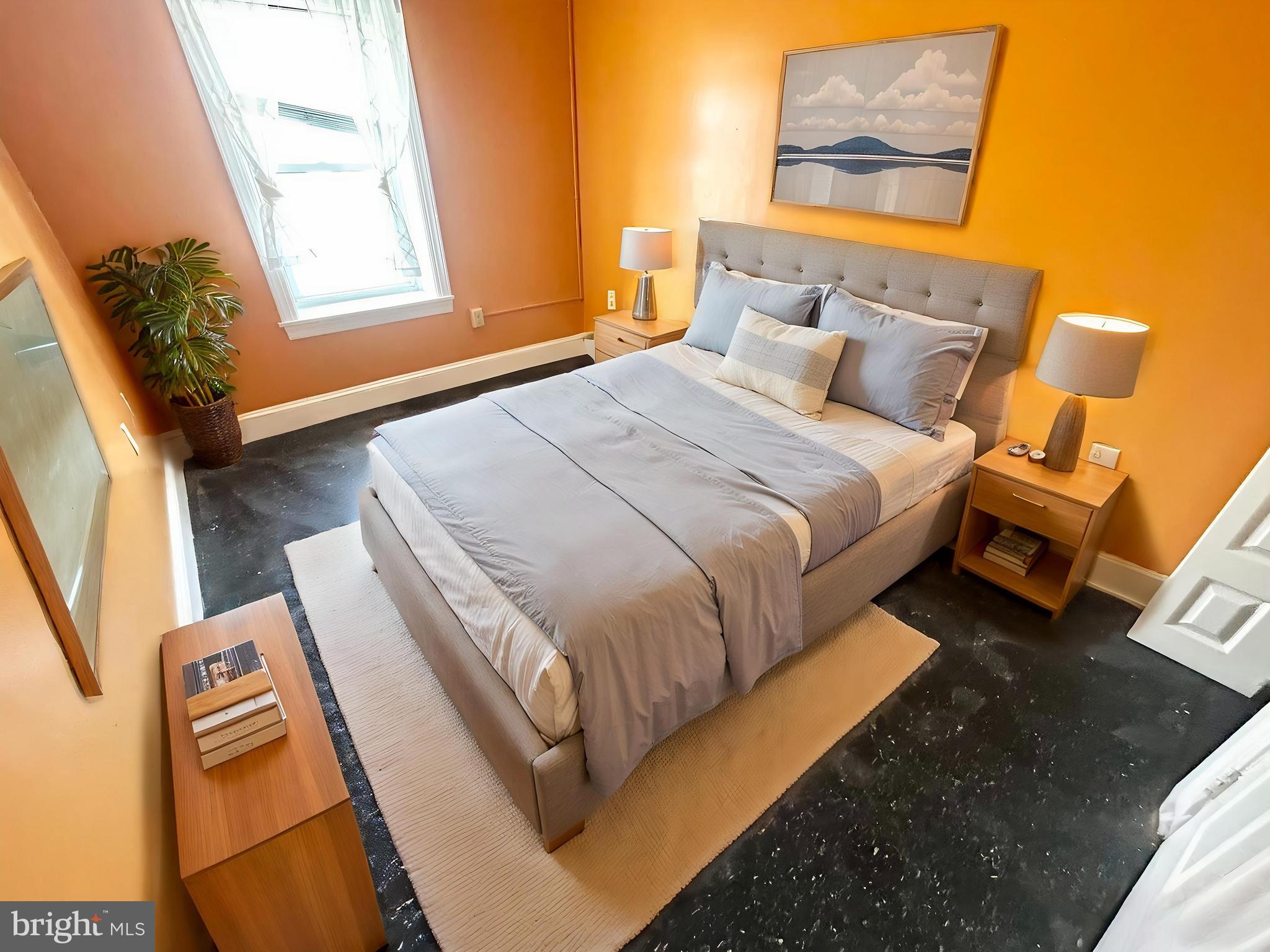 3618 Spring Garden Street, Unit 3 Philadelphia, PA 19104 - Photo 2 of 13 a bed sitting in a bedroom next to a window