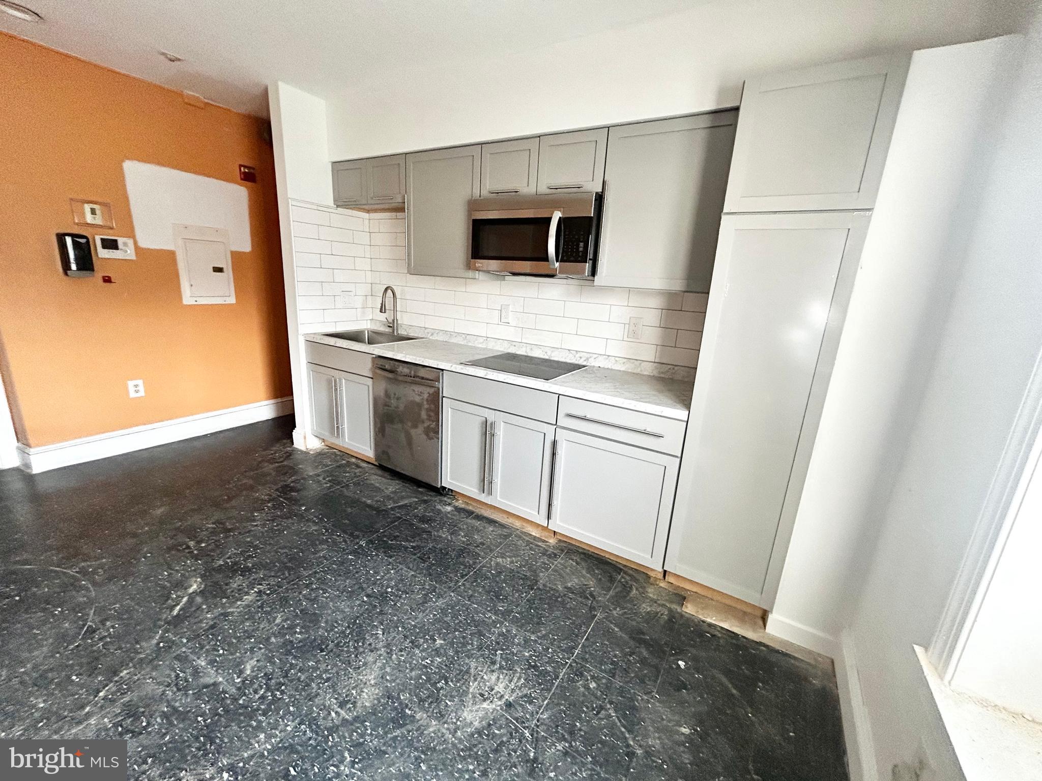 3618 Spring Garden Street, Unit 3 Philadelphia, PA 19104 - Photo 4 of 13 a view of a kitchen with a sink and an oven