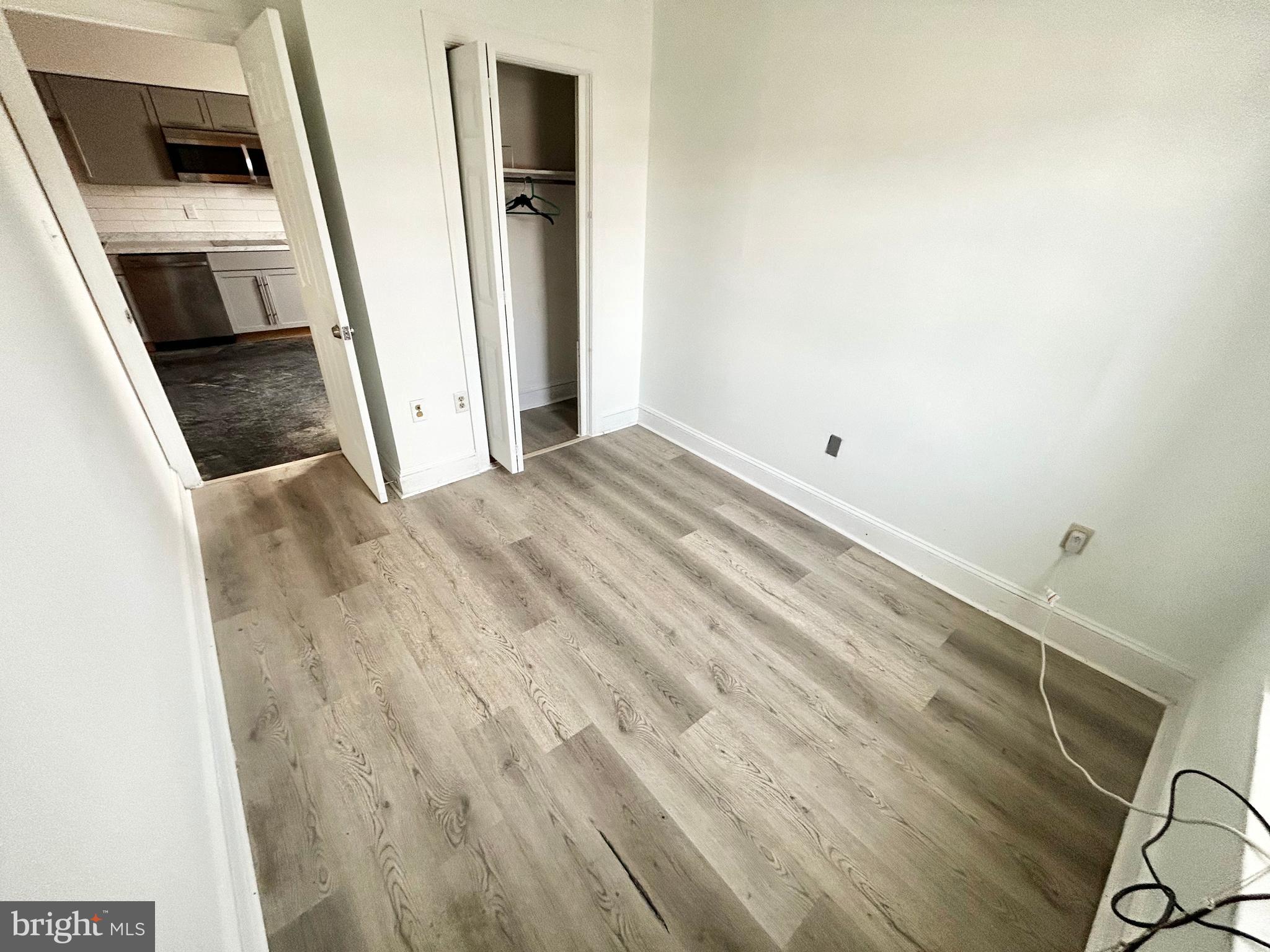 3618 Spring Garden Street, Unit 3 Philadelphia, PA 19104 - Photo 6 of 13 a view of a kitchen from a hallway