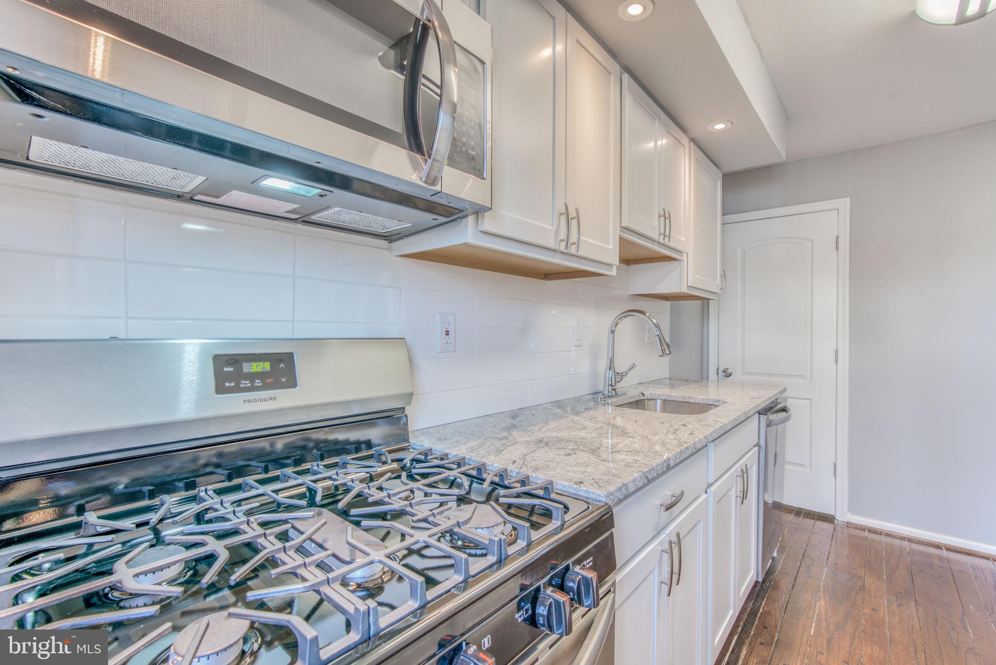 531 Grovethorn Road Baltimore, MD 21220 - Photo 18 of 56 a kitchen with a stove and a sink