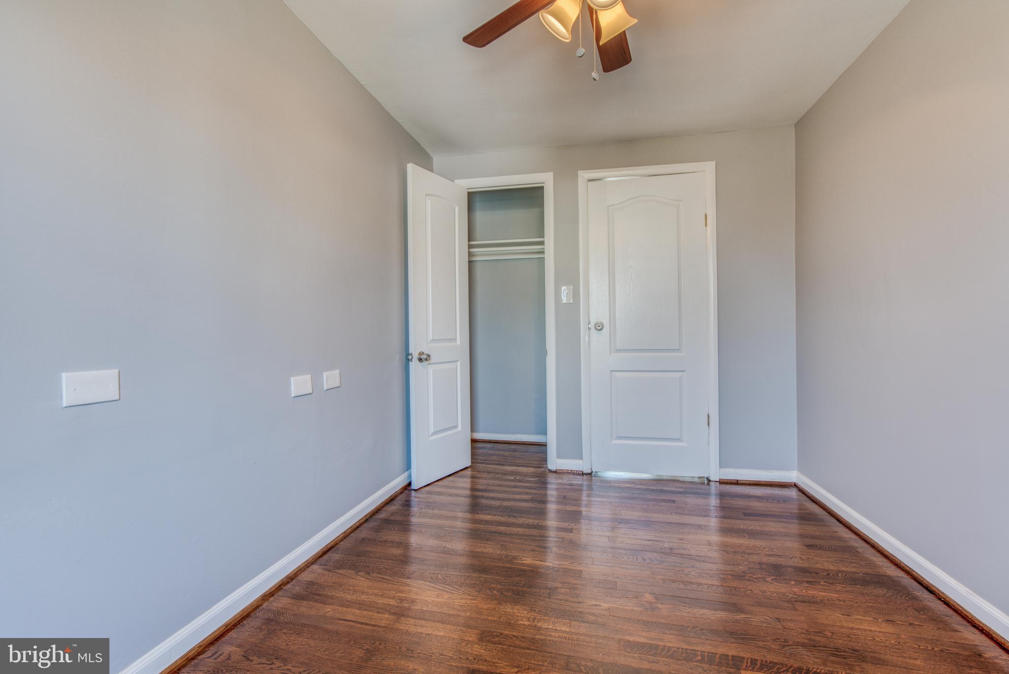 531 Grovethorn Road Baltimore, MD 21220 - Photo 35 of 56 a view of an empty room with wooden floor