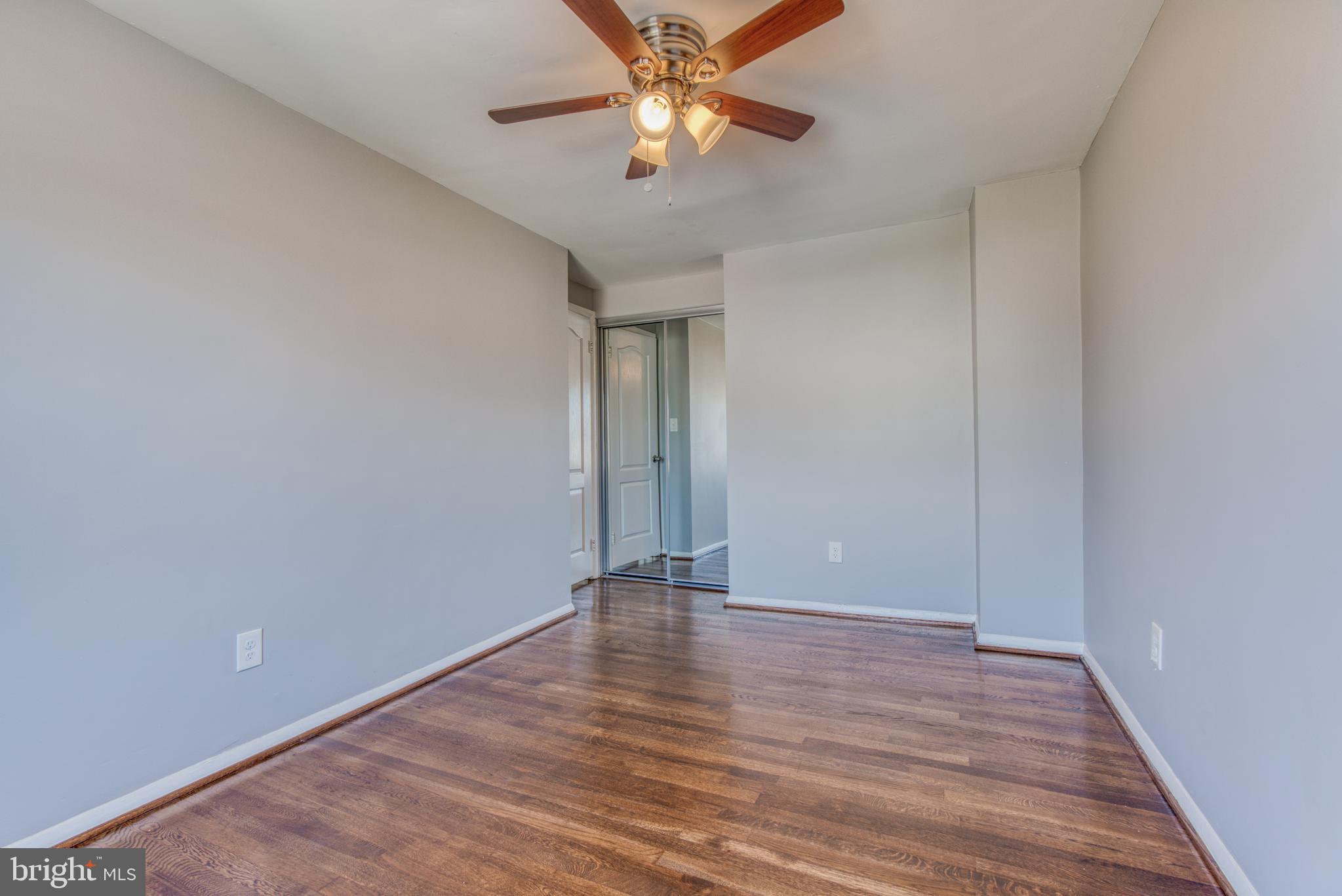 531 Grovethorn Road Baltimore, MD 21220 - Photo 38 of 56 a view of an empty room with window and wooden floor