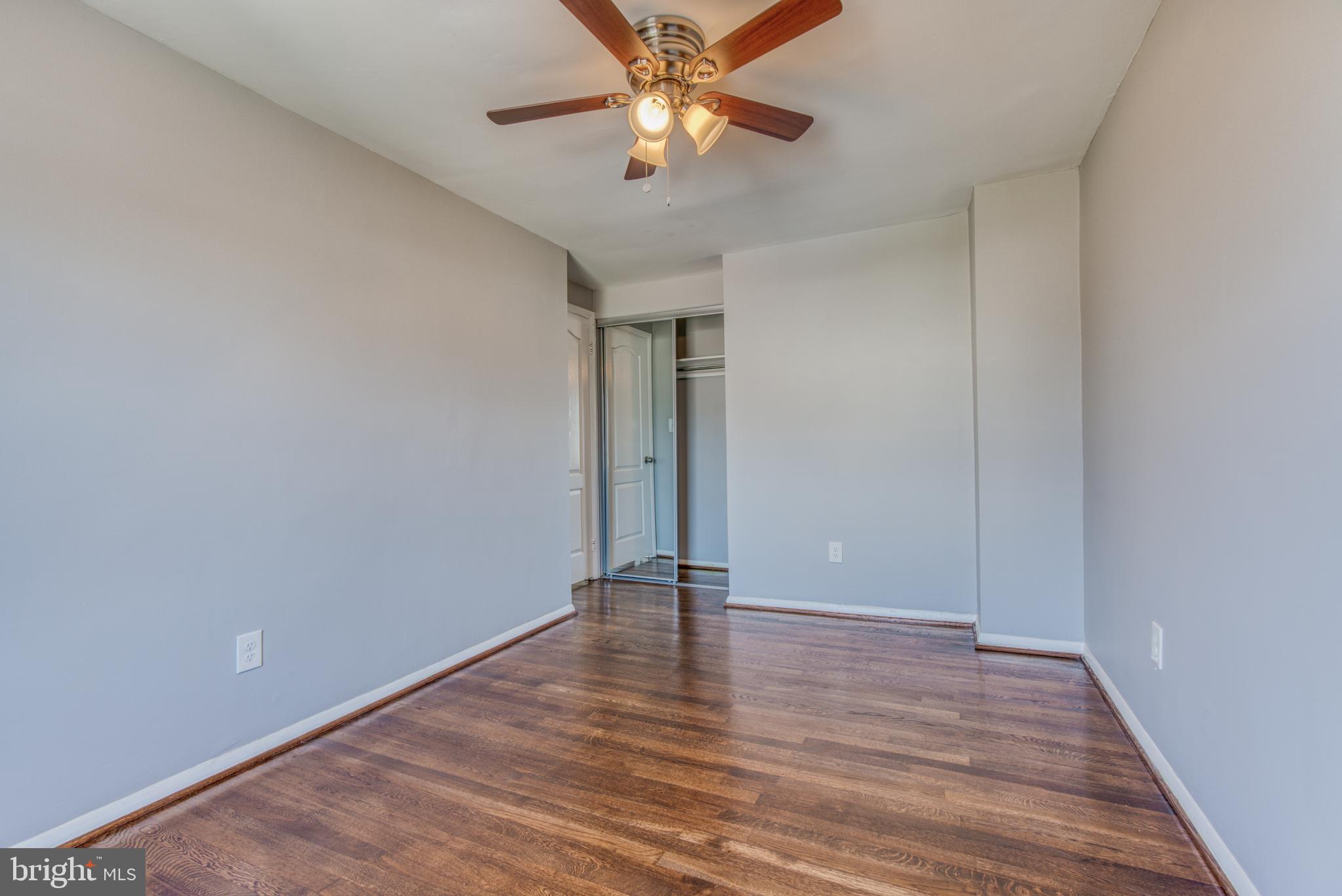 531 Grovethorn Road Baltimore, MD 21220 - Photo 39 of 56 a view of an empty room with window and wooden floor