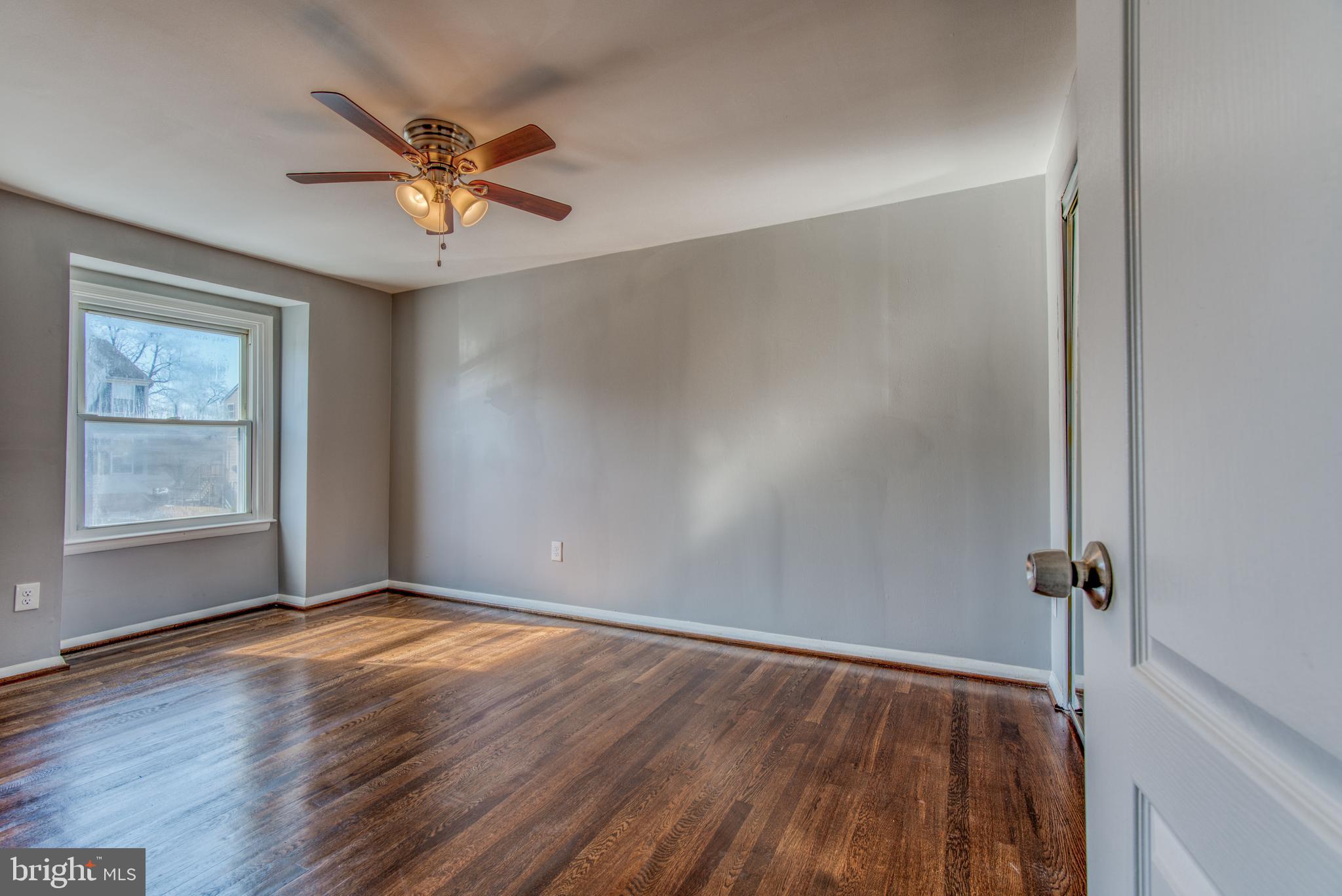 531 Grovethorn Road Baltimore, MD 21220 - Photo 40 of 56 wooden floor in an empty room with a window