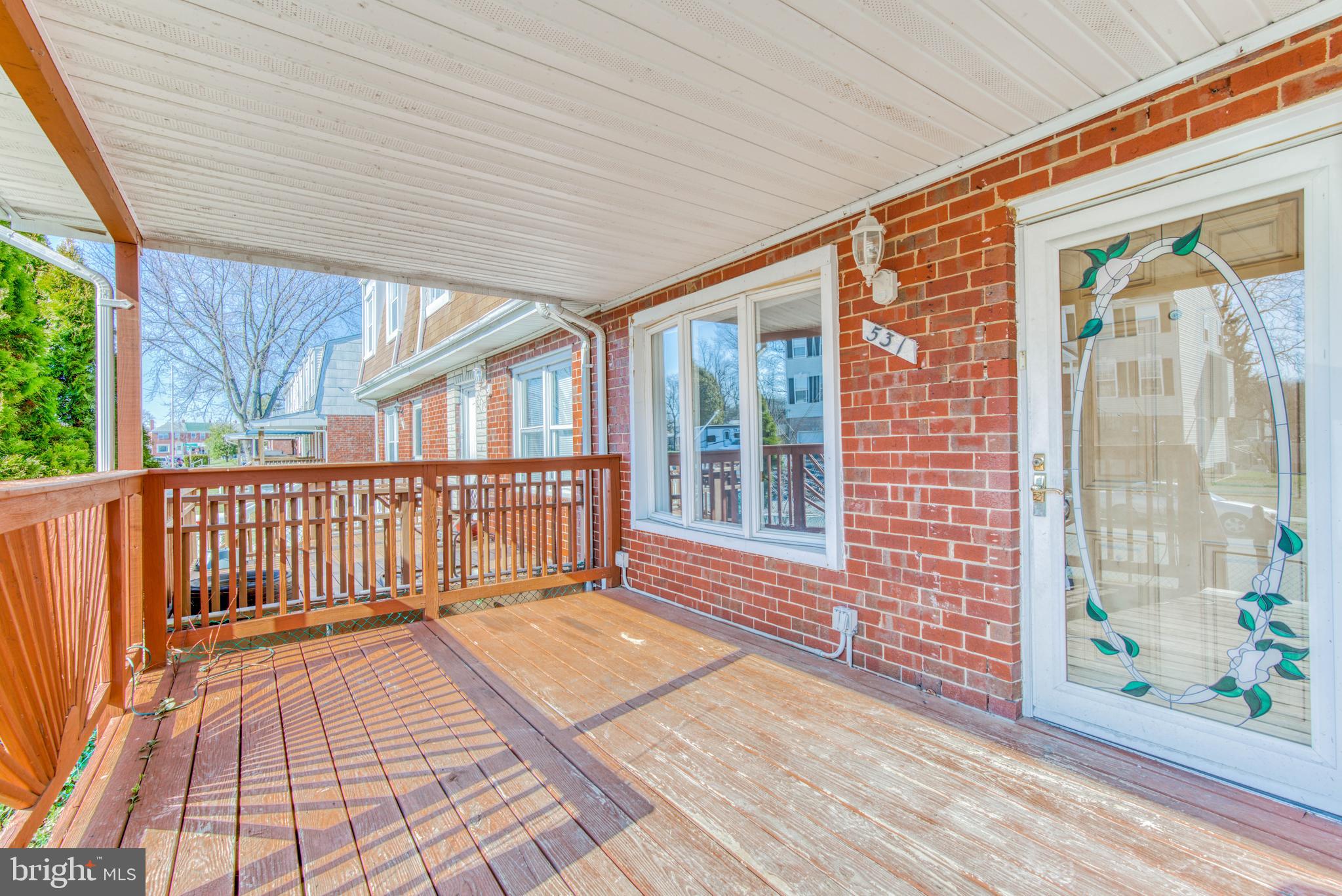 531 Grovethorn Road Baltimore, MD 21220 - Photo 53 of 56 a view of a porch with wooden floor and floor to ceiling window
