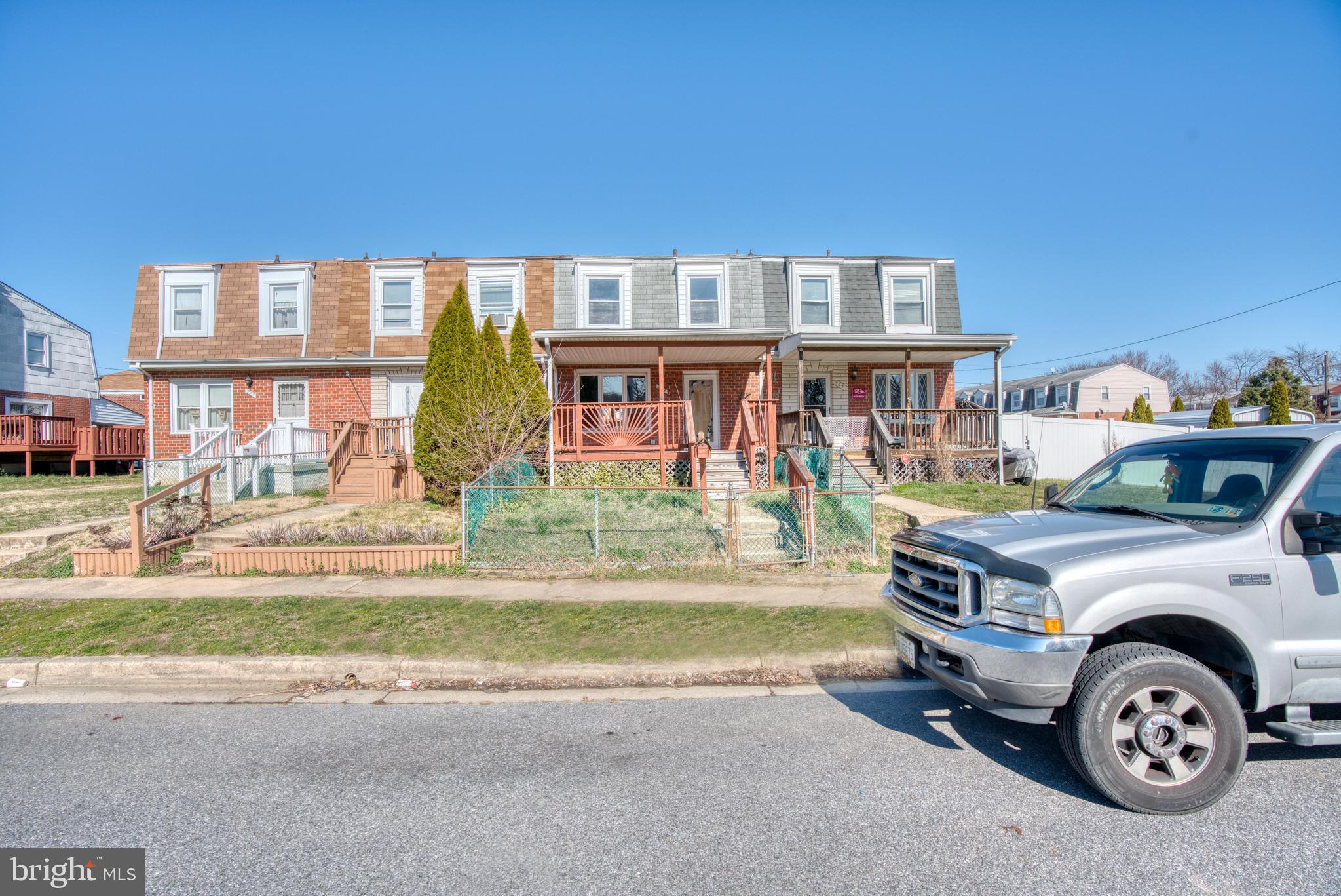531 Grovethorn Road Baltimore, MD 21220 - Photo 56 of 56 a front view of a house with a garden and parking space