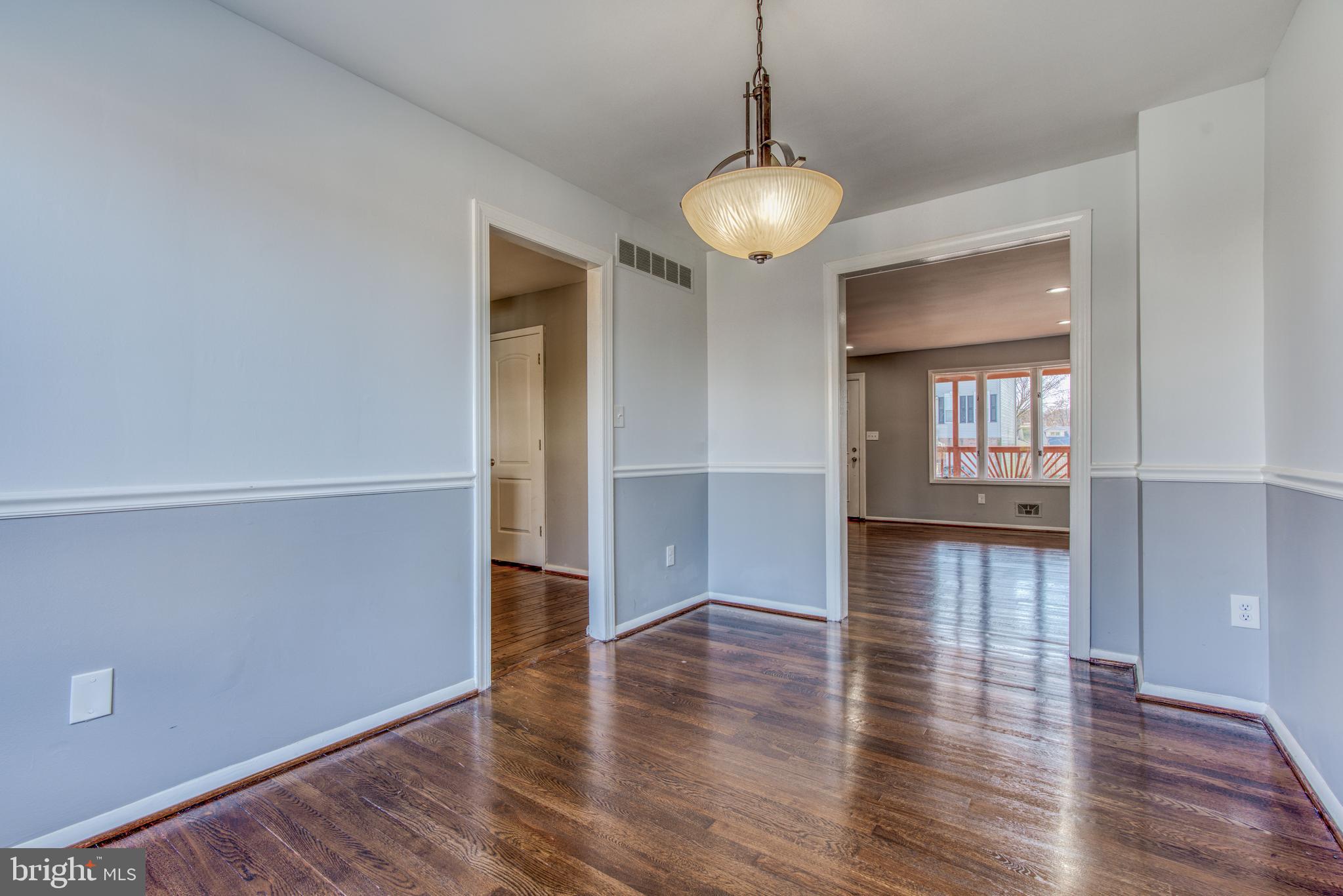 531 Grovethorn Road Baltimore, MD 21220 - Photo 10 of 56 a view of an empty room with wooden floor and a window