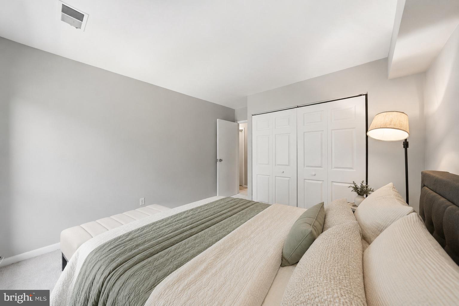 11252 Chestnut Grove Square, Unit 248 Reston, VA 20190 - Photo 16 of 25 Serene bedroom with modern elegance.