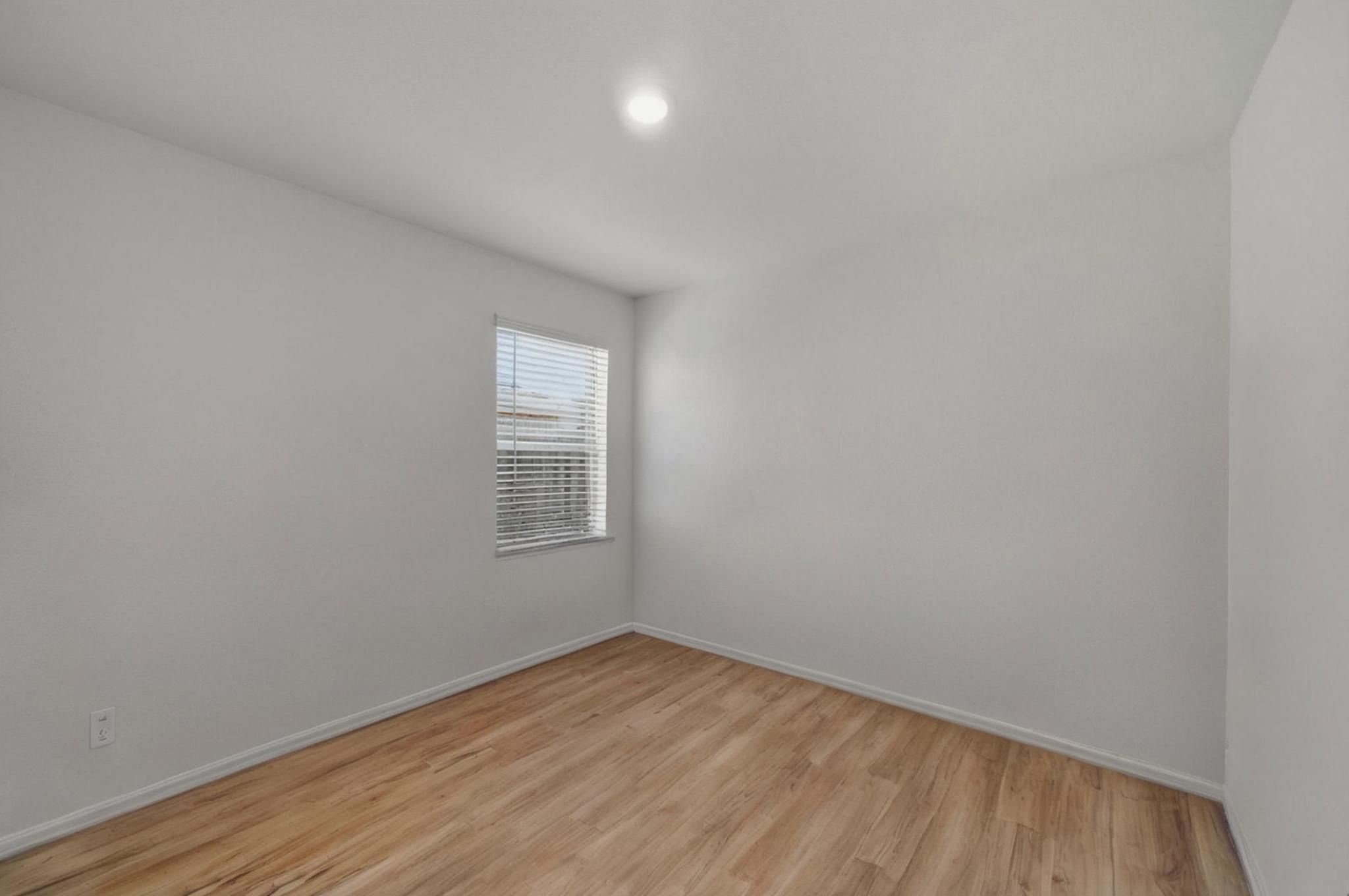 14502 Woodcott Warren Way Rosharon, TX 77583 - Photo 11 of 37 Secondary Bedroom 2—shown cleared of furnishings to better visualize the space and imagine your own design and use.