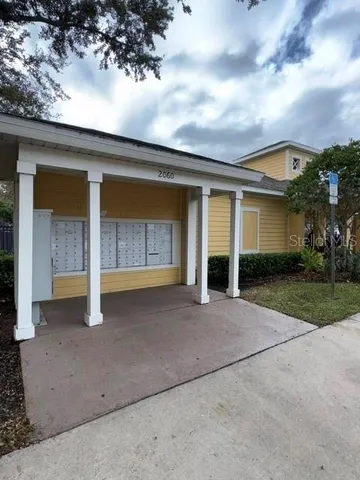 a view of a garden with wooden fence