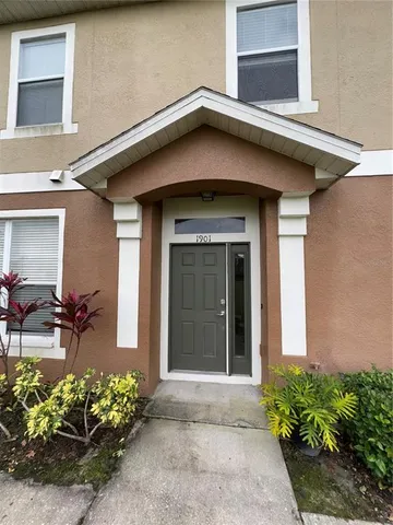a view of a house with a flower garden