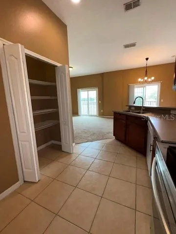 a kitchen with stainless steel appliances granite countertop a refrigerator sink and cabinets