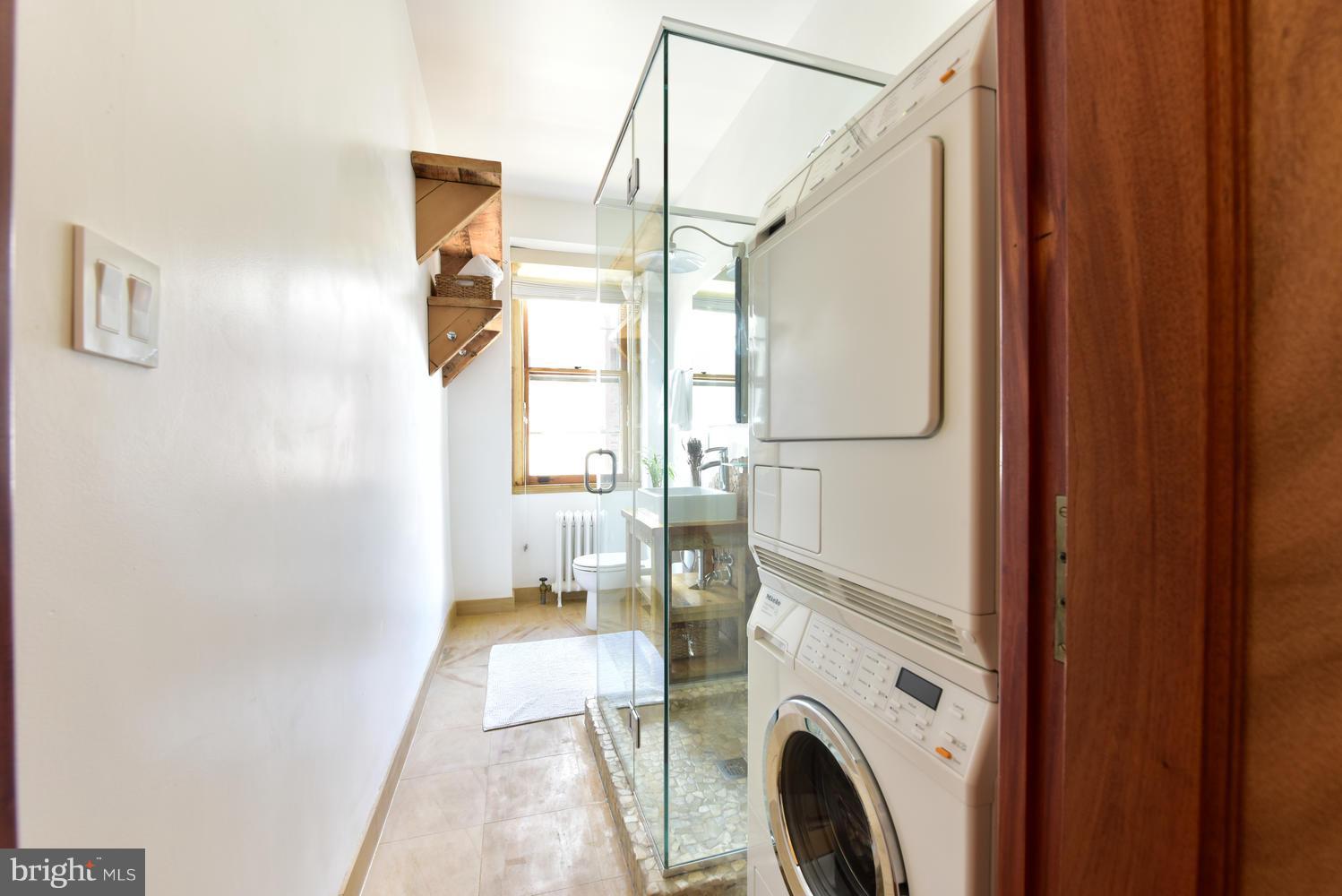 1725 17th Street Northwest, Unit 207 Washington, DC 20009 - Photo 14 of 28 a view of hallway with washer and dryer