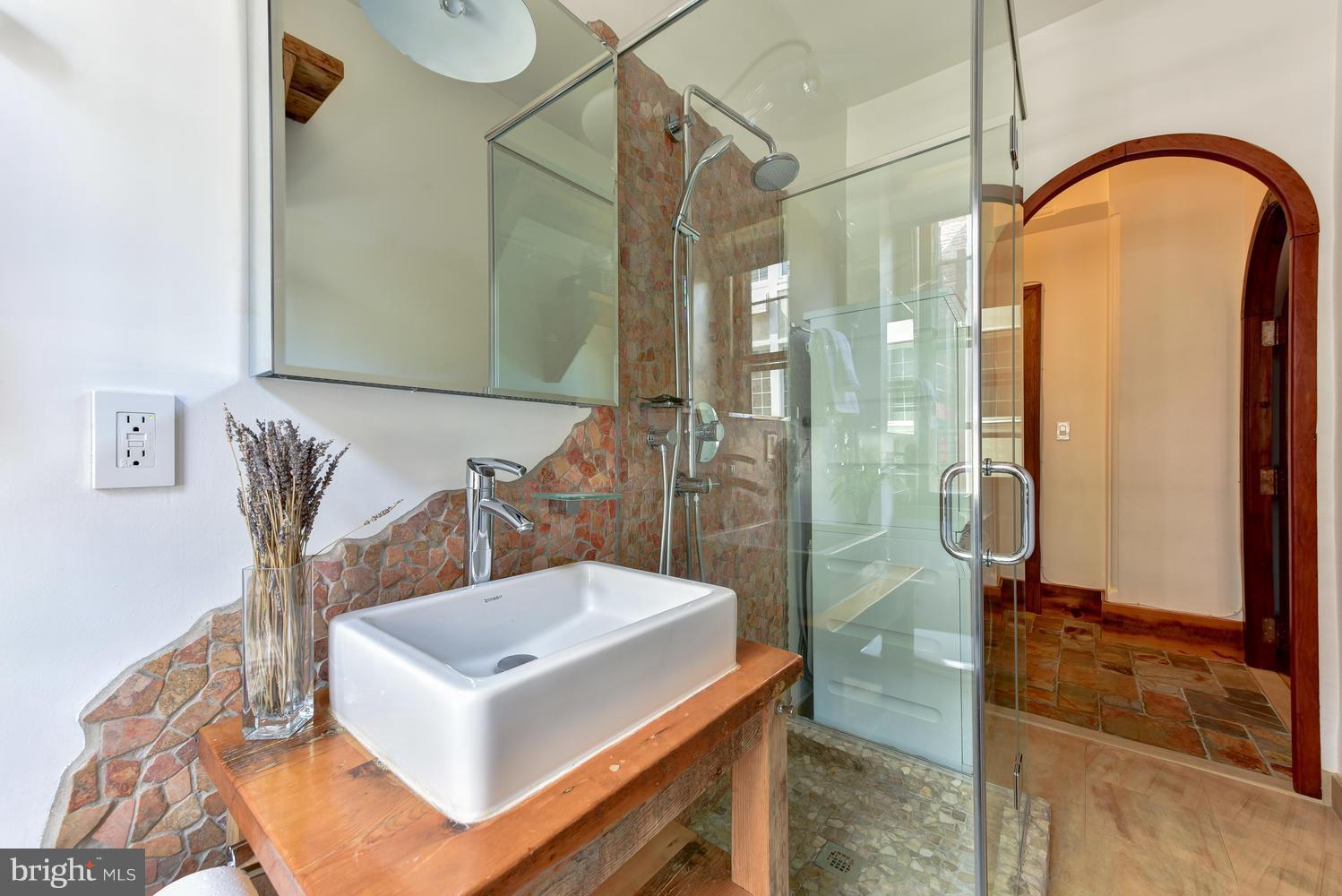1725 17th Street Northwest, Unit 207 Washington, DC 20009 - Photo 17 of 28 a bathroom with a sink and mirror
