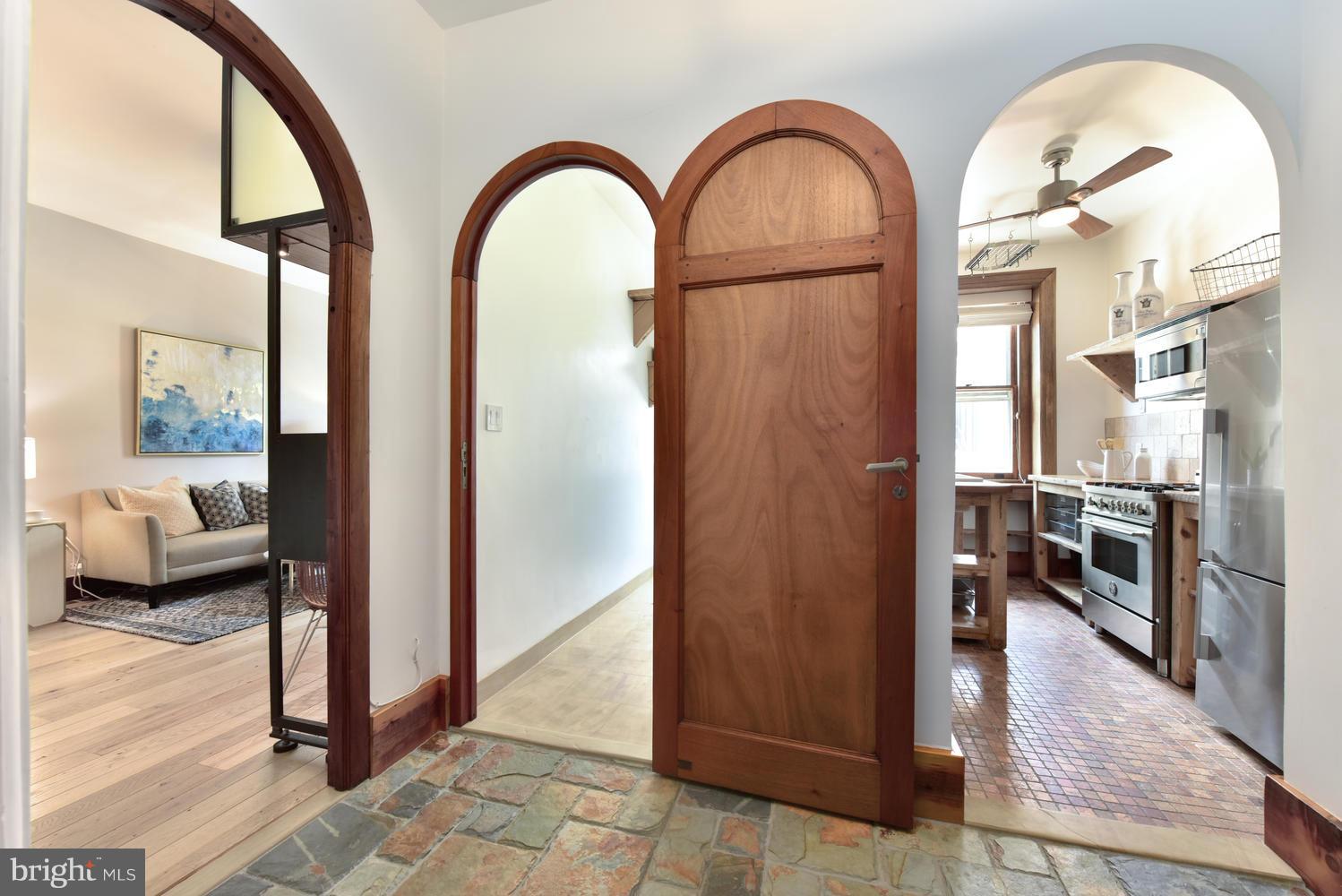1725 17th Street Northwest, Unit 207 Washington, DC 20009 - Photo 21 of 28 a view of living room and hallway with wooden floor