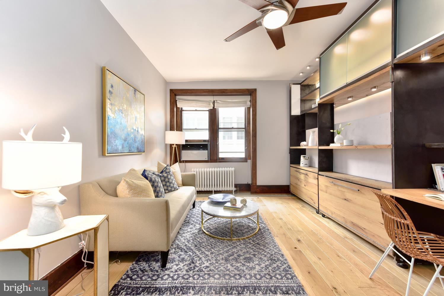 1725 17th Street Northwest, Unit 207 Washington, DC 20009 - Photo 4 of 28 a living room with furniture and a window