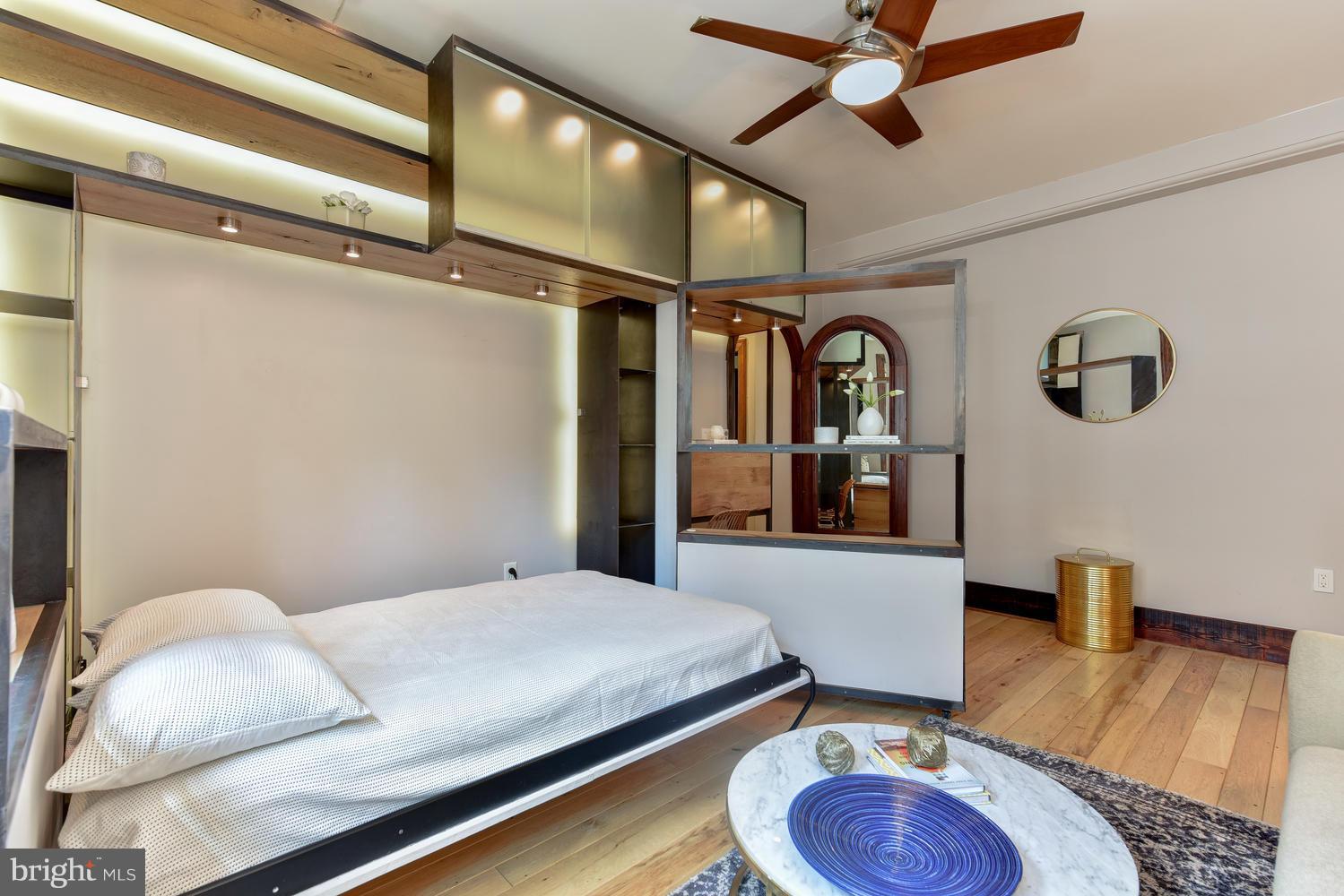 1725 17th Street Northwest, Unit 207 Washington, DC 20009 - Photo 8 of 28 a room with a bed and wooden floor