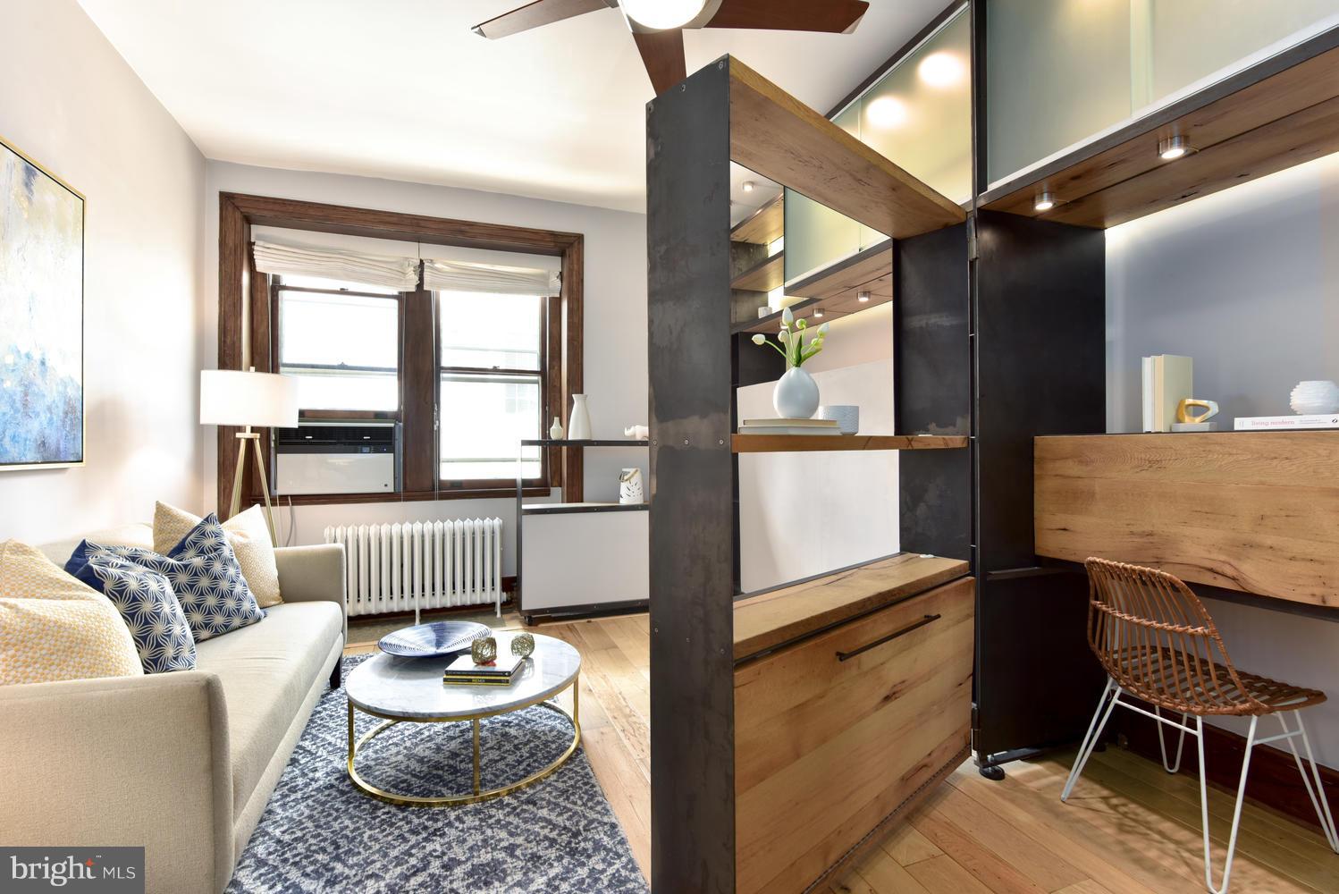1725 17th Street Northwest, Unit 207 Washington, DC 20009 - Photo 9 of 28 a living room with furniture and a window