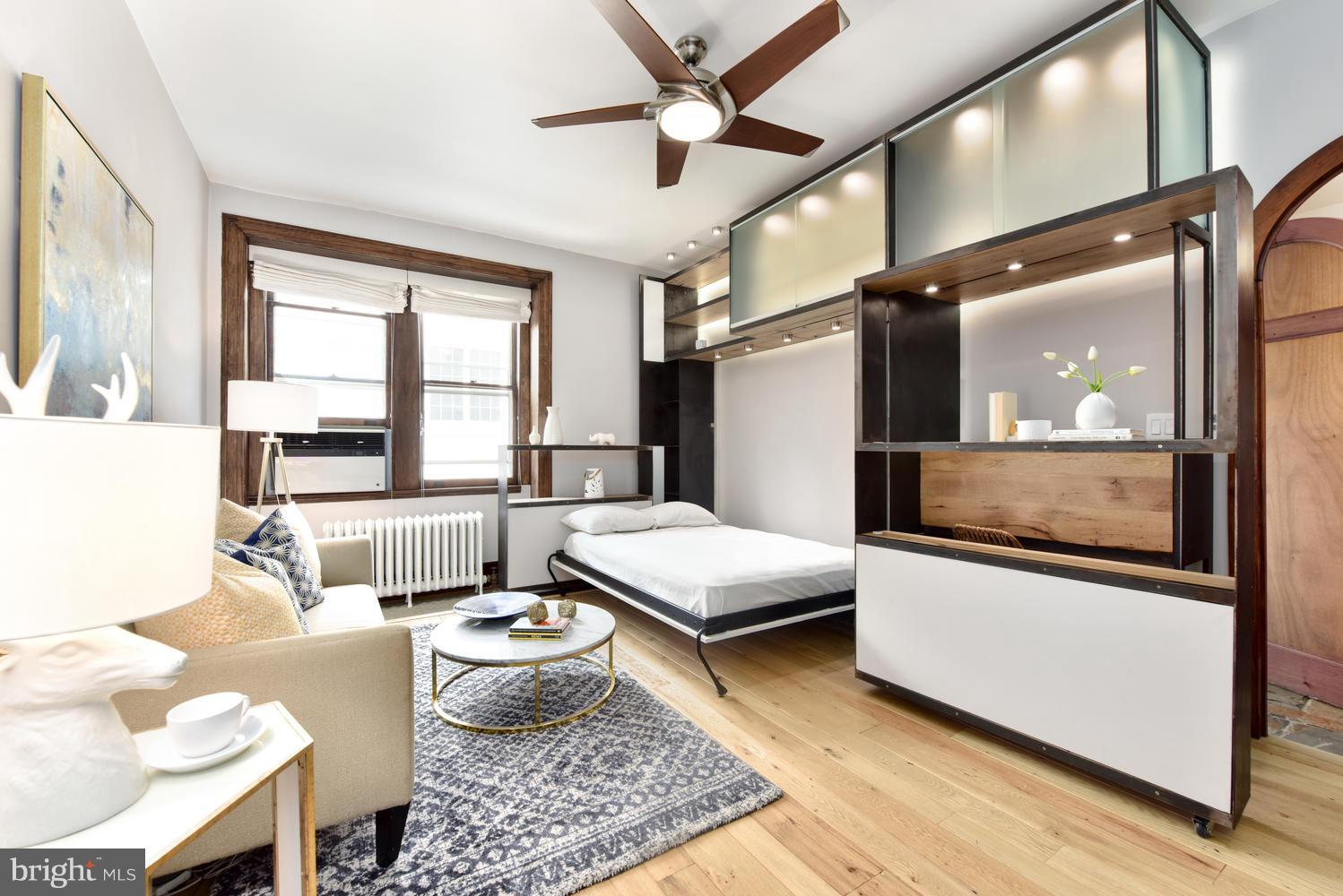 1725 17th Street Northwest, Unit 207 Washington, DC 20009 - Photo 10 of 28 a living room with furniture and a large window