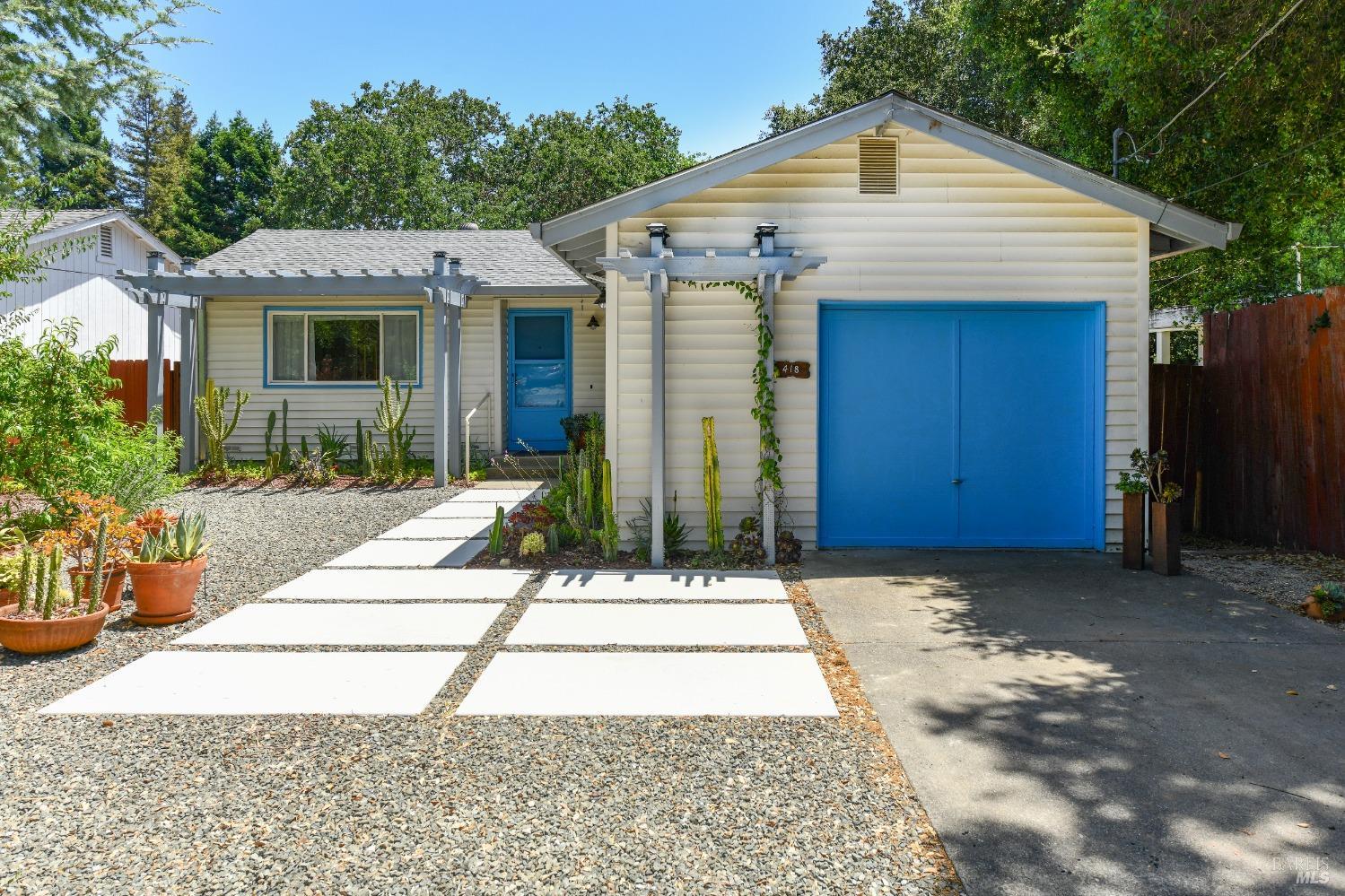a front view of a house with garden