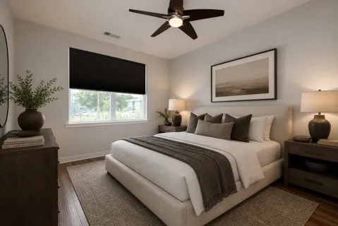 a bedroom with bed and window