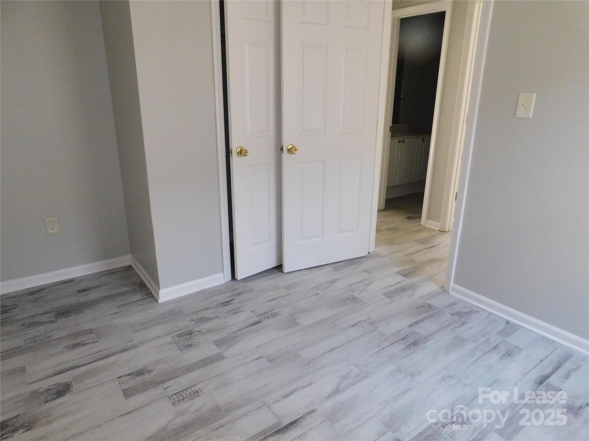 1119 Hannah Rae Court Charlotte, NC 28214 - Photo 14 of 19 a view of a hallway with wooden floor