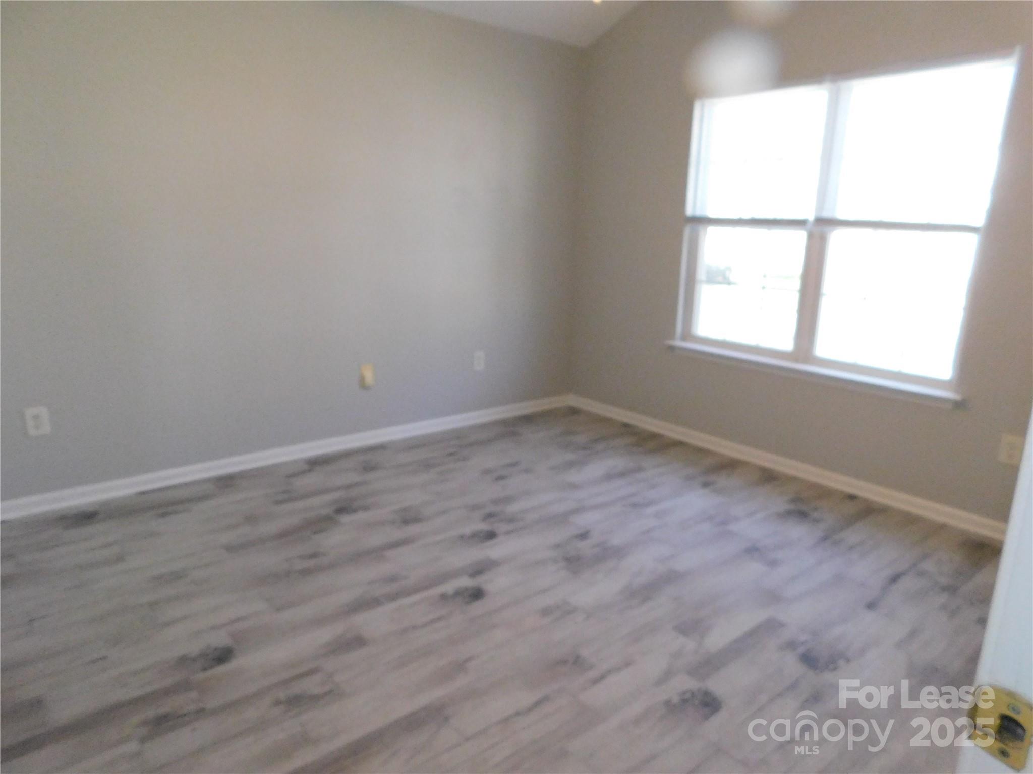 1119 Hannah Rae Court Charlotte, NC 28214 - Photo 16 of 19 an empty room with a window