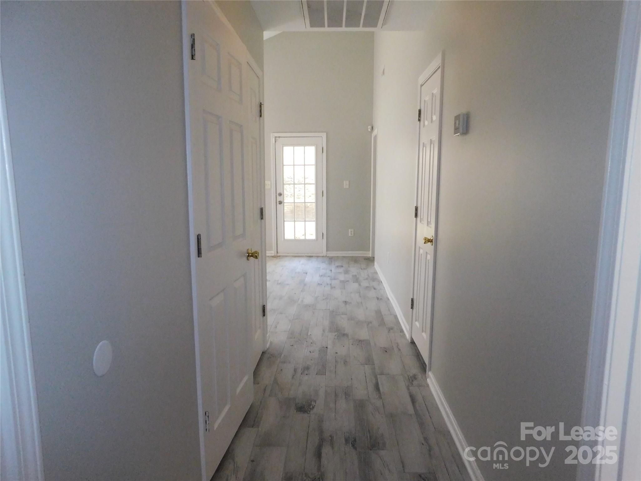 1119 Hannah Rae Court Charlotte, NC 28214 - Photo 4 of 19 a view of a room with wooden floor and a bathroom
