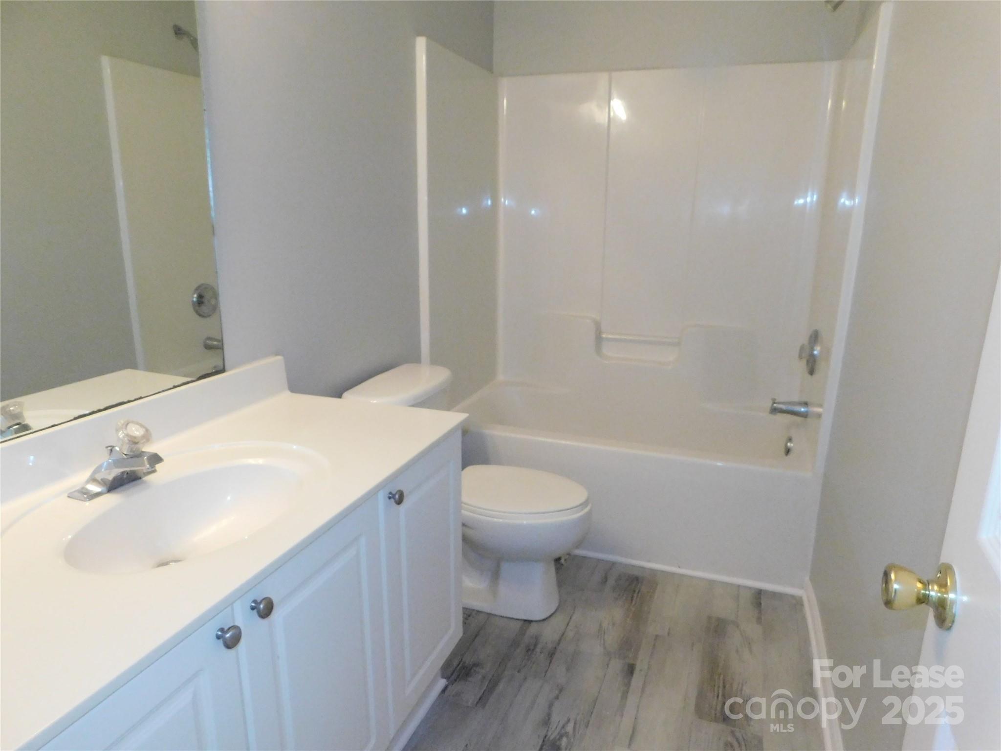 1119 Hannah Rae Court Charlotte, NC 28214 - Photo 10 of 19 a bathroom with a sink a toilet and shower