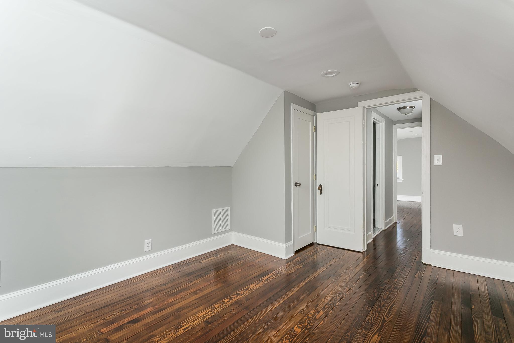 421 Dunkirk Road Baltimore, MD 21212 - Photo 22 of 25 a view of an empty room with wooden floor
