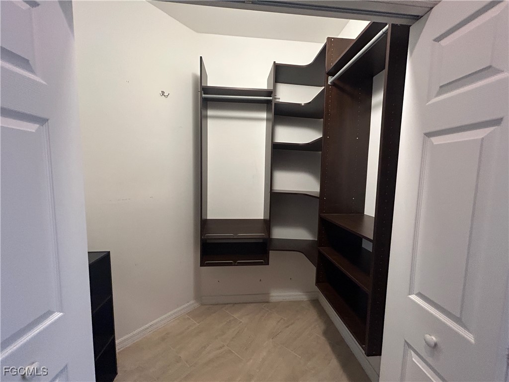 Undisclosed Address Cape Coral, FL 33991 - Photo 11 of 40 a view of walk in closet