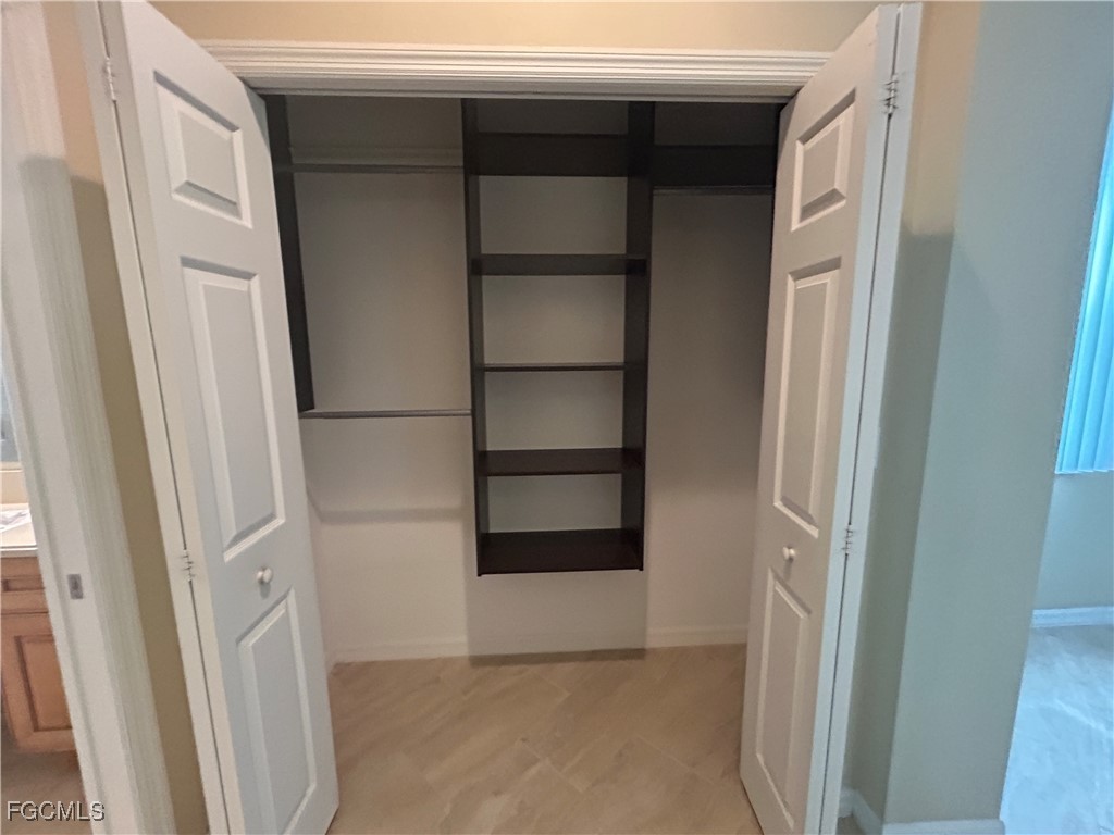 Undisclosed Address Cape Coral, FL 33991 - Photo 12 of 40 a view of an empty walk in closet