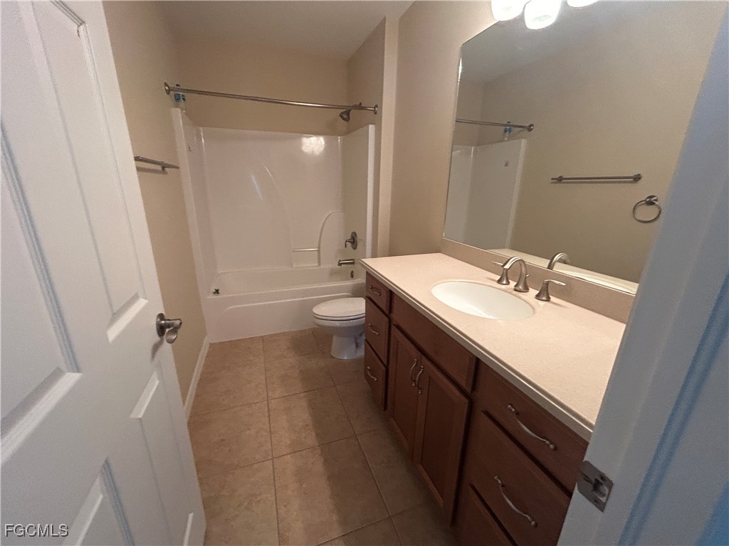 Undisclosed Address Cape Coral, FL 33991 - Photo 16 of 40 a bathroom with a sink a toilet a tub and shower