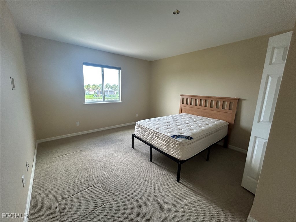 Undisclosed Address Cape Coral, FL 33991 - Photo 17 of 40 a living room with a table and a window