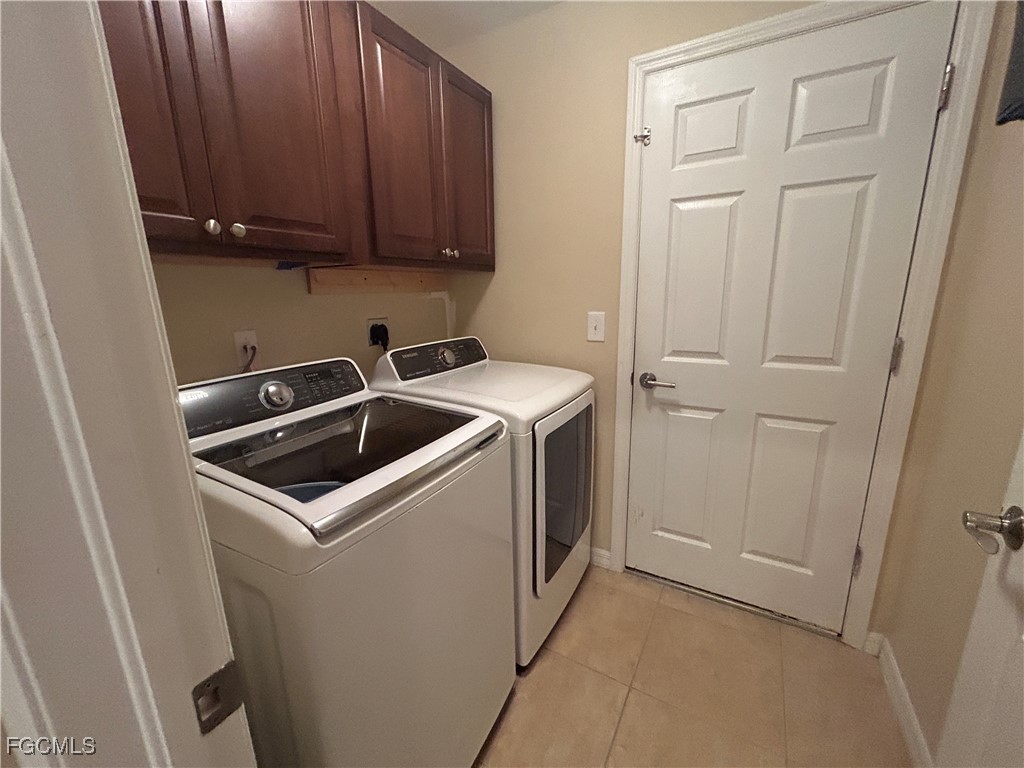 Undisclosed Address Cape Coral, FL 33991 - Photo 19 of 40 a utility room with dryer and washer