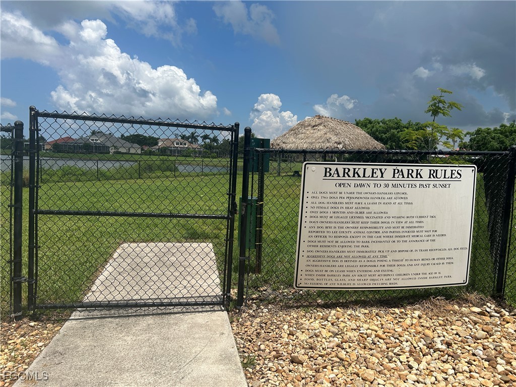 Undisclosed Address Cape Coral, FL 33991 - Photo 23 of 40 a front view of a house with a garden