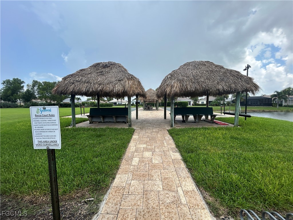 Undisclosed Address Cape Coral, FL 33991 - Photo 27 of 40 a front view of a house with garden
