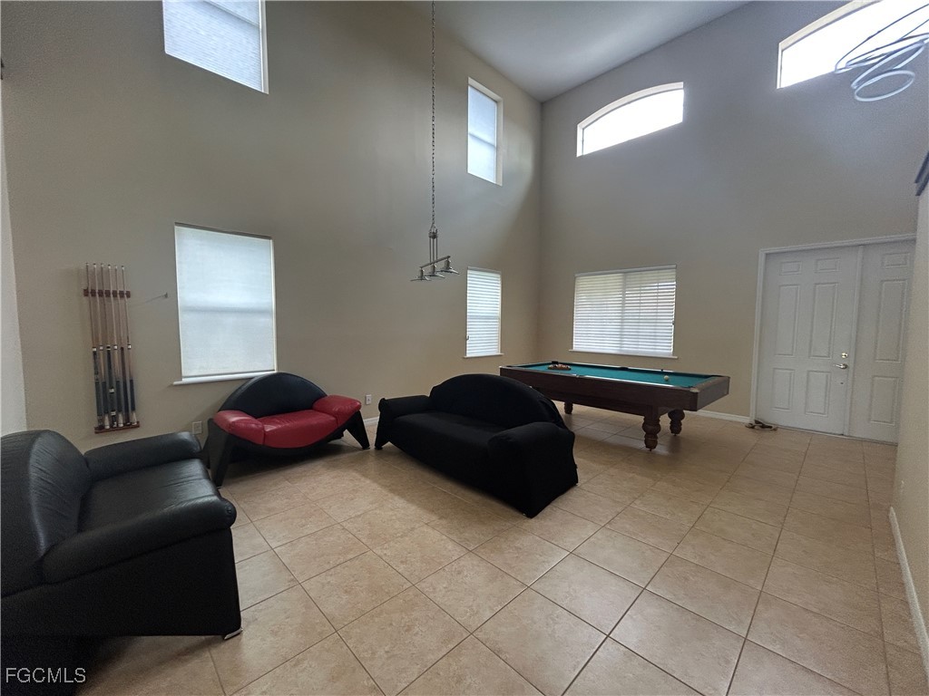 Undisclosed Address Cape Coral, FL 33991 - Photo 3 of 40 a living room with furniture and a window