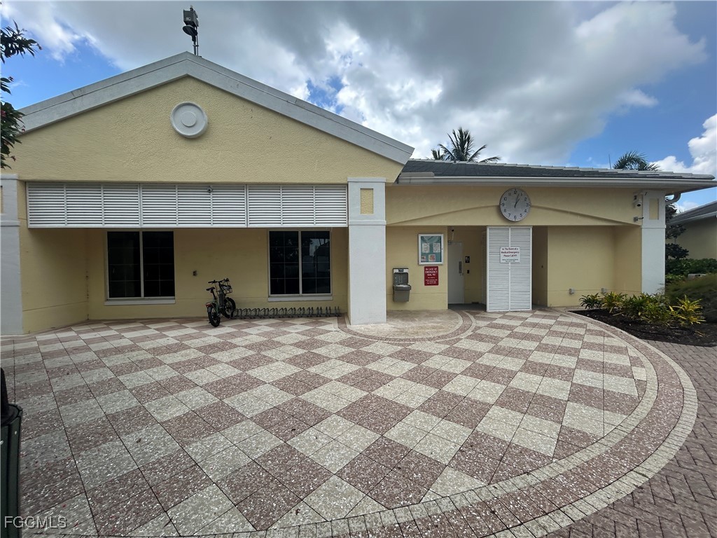 Undisclosed Address Cape Coral, FL 33991 - Photo 32 of 40 a view of a house with a yard and potted plants