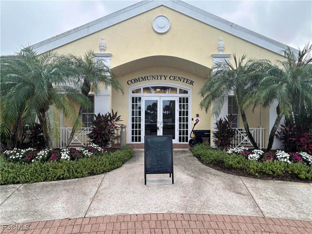 Undisclosed Address Cape Coral, FL 33991 - Photo 35 of 40 a front view of a house with garden