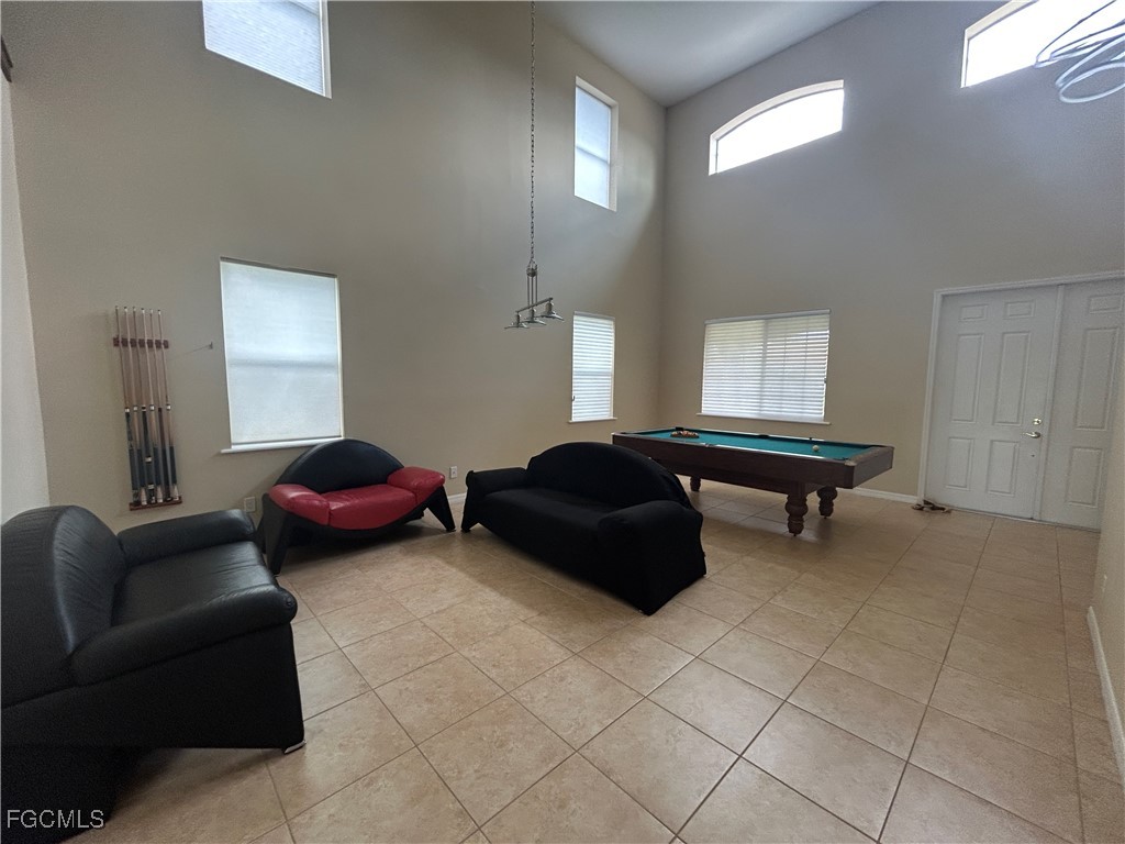 Undisclosed Address Cape Coral, FL 33991 - Photo 4 of 40 a bedroom with furniture and a window