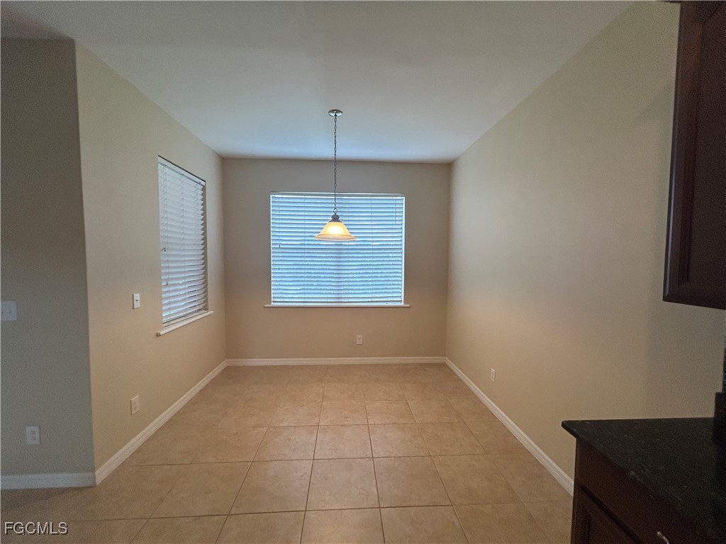 Undisclosed Address Cape Coral, FL 33991 - Photo 6 of 40 an empty room with windows and fan